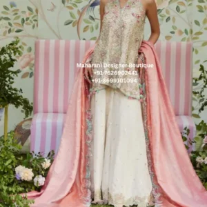 Pastel Embroidered Sharara Suit with Pink Dupatta Introducing the Blush Garden Pastel Sharara Suit, an elegant statement outfit created for women who love soft colours, intricate embroidery, and graceful ethnic fashion. This beautiful three-piece ensemble features a delicately embellished pastel kurta, a flowing ivory sharara, and a dreamy blush pink dupatta that brings the entire look together. The outfit showcases a sophisticated pastel palette with soft blush pink, ivory, mint, and subtle multicolour detailing. The embroidered kurta features intricate floral-inspired motifs and delicate embellishment, giving the outfit a refined festive appearance. The sleeveless silhouette creates a contemporary feel while retaining the elegance of traditional Indian ethnic wear. The ivory sharara adds beautiful volume and movement to the outfit. Its flowing silhouette makes it perfect for festive celebrations, wedding functions, engagement parties, mehndi events, sangeet ceremonies, receptions, family celebrations, and elegant evening gatherings. The soft ivory shade beautifully complements the pastel embroidered top and creates a balanced, luxurious appearance. The blush pink dupatta adds an extra layer of femininity and charm. Its delicate embellishment and decorative edging beautifully frame the outfit, while the lightweight-looking drape gives the ensemble an effortless festive finish. This pastel sharara suit for women is an excellent choice for anyone looking for a sophisticated ethnic outfit that feels traditional yet modern. The soft colour combination makes it especially suitable for daytime weddings, summer celebrations, festive brunches, engagement ceremonies, and intimate wedding functions. The embroidery across the kurta creates a detailed handcrafted-inspired appearance. Floral and ornamental motifs are arranged throughout the front, adding depth and visual interest without overwhelming the pastel base. The neckline is beautifully embellished to draw attention toward the face and enhance the overall elegance of the outfit. The ivory sharara provides a graceful contrast to the embroidered upper layer. Its wide, flowing shape creates an attractive silhouette and allows the outfit to move beautifully while walking. Paired with the pastel kurta and pink dupatta, the combination creates a soft luxury aesthetic that works beautifully for special occasions. Why You'll Love This Outfit Elegant pastel colour palette Intricate floral-inspired embroidery Beautiful blush pink dupatta Graceful ivory sharara silhouette Contemporary sleeveless kurta styling Perfect for wedding and festive occasions Suitable for engagement and mehndi celebrations Ideal for daytime and evening events Feminine and sophisticated appearance Versatile ethnic party wear outfit Beautiful choice for modern Indian fashion lovers Suitable for boutique ethnic wear styling Perfect Occasions The Blush Garden Pastel Sharara Suit can be styled for a variety of celebrations and special occasions. Wear it for a mehndi ceremony when you want a fresh and feminine appearance, or choose it for a daytime engagement when you prefer soft pastel tones. It can also be worn for: Wedding guest outfits Engagement parties Mehndi ceremonies Sangeet functions Reception celebrations Festive parties Diwali gatherings Eid celebrations Family functions Festive brunches Wedding photoshoots Traditional celebrations Destination weddings Anniversary celebrations Cocktail-style ethnic events Styling Ideas Pair this pastel sharara outfit with statement jhumkas, delicate bangles, embellished heels, and a small potli bag for a traditional festive look. For a more contemporary appearance, choose minimal jewellery, soft makeup, and elegant heels. The blush pink dupatta can be draped over one shoulder for a relaxed appearance or styled traditionally across both shoulders. You can also experiment with a front pleated drape to highlight the embroidery on the kurta. For daytime events, soft pink or nude makeup complements the pastel tones beautifully. For evening occasions, slightly more defined eyes and statement earrings can create a glamorous appearance. sharara suit pastel sharara suit, embroidered sharara suit, pastel sharara set, designer sharara suit, wedding guest sharara, party wear sharara suit, embroidered ethnic wear, women sharara suit, Indian sharara outfit, pastel ethnic wear, pink dupatta sharara, ivory sharara suit, festive sharara outfit, wedding wear for women, engagement outfit for women, mehndi sharara suit, sangeet outfit for women, luxury sharara suit, boutique sharara suit, traditional Indian outfit, modern ethnic wear, festive party wear, embroidered party wear suit, pastel wedding outfit, sharara suit online, Indian ethnic outfit for women
