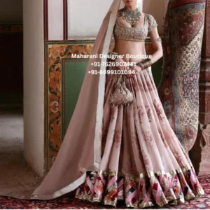 Rosewood Heritage Blush Pink Bridal Lehenga Choli The Blush Pink Bridal Lehenga Choli is an elegant statement ensemble created for brides who love timeless Indian bridal fashion with a sophisticated contemporary touch. Designed in a soft blush pink and rose-toned palette, this luxurious lehenga features intricate floral embroidery, a heavily embellished choli, a beautifully flared lehenga skirt, and a graceful matching dupatta. The blouse showcases detailed embroidery across the neckline, sleeves, and bodice, creating a richly embellished bridal appearance. The coordinated lehenga features floral and ornamental motifs arranged beautifully across the panels, while the broad decorative hem adds a striking finishing touch. One of the standout elements of this bridal lehenga is its dramatic multicolour embroidered border. Rich pink, rose, peach, ivory, and metallic accents create a beautiful contrast against the soft pastel base. The combination gives the outfit a regal yet romantic character, making it an excellent choice for brides looking for something distinctive for their wedding celebrations. The lightweight-looking blush dupatta completes the ensemble with an elegant drape. Its delicate border frames the outfit beautifully and adds a soft, graceful layer to the bridal look. This pink bridal lehenga choli is ideal for wedding ceremonies, engagement celebrations, bridal portraits, reception events, sangeet nights, and other special occasions. The pastel colour makes it especially appealing to modern brides who want a softer alternative to traditional deep-red bridal outfits. Key Features Blush pink and rose-toned bridal colour palette Intricately embroidered lehenga Heavily embellished bridal choli Floral and ornamental embroidery Statement multicolour lehenga border Elegant matching dupatta Traditional bridal silhouette Contemporary pastel bridal styling Suitable for wedding and reception celebrations Ideal for bridal photography and special occasions Perfect For This designer bridal lehenga choli can be styled for a variety of wedding events, including: Bridal wedding ceremony Engagement ceremony Sangeet night Mehndi function Wedding reception Bridal photoshoot Destination wedding Family wedding celebration Cocktail-style wedding event Festive celebration MDB 19427 ,MDB 21581 ,MDB 15089 ,MDB 22624 ,Luxury Floral Styling Suggestions Complete the look with traditional bridal jewellery such as a statement choker, layered necklace, jhumkas, bangles, maang tikka, and a delicate bridal nath. Soft glam makeup with rosy or nude tones will complement the pastel colour beautifully. For footwear, embellished heels or traditional bridal sandals can complete the ensemble. A coordinated embroidered potli bag can also add a sophisticated finishing touch. The dupatta can be draped traditionally over the head for a classic bridal appearance or styled over one shoulder for a more contemporary wedding look. Why Choose This Lehenga? The Rosewood Heritage Blush Pink Bridal Lehenga combines traditional craftsmanship-inspired detailing with a modern pastel aesthetic. Its floral embroidery creates a romantic visual appeal, while the contrasting border adds richness and depth. The soft pink base makes the outfit versatile enough for brides who want an elegant bridal look without relying solely on conventional red. The detailed embroidery ensures that the outfit still has the grandeur expected from a special wedding ensemble. Whether worn for the main wedding ceremony or a glamorous reception, this lehenga offers a graceful silhouette and a luxurious appearance suitable for memorable celebrations. pink bridal lehenga, blush pink bridal lehenga, pastel pink lehenga, bridal lehenga choli, designer bridal lehenga, embroidered bridal lehenga, wedding lehenga for bride, pink lehenga choli, pastel bridal outfit, luxury bridal lehenga, floral embroidered lehenga, bridal wedding outfit, Indian bridal lehenga, wedding wear lehenga, bridal lehenga online, lehenga choli for bride, reception lehenga, engagement lehenga, sangeet lehenga, mehndi lehenga, pastel wedding outfit, blush pink wedding lehenga, embroidered lehenga for bride, designer lehenga for wedding, bridal ethnic wear, luxury wedding outfit, modern bridal lehenga, traditional bridal lehenga, Indian wedding outfit for women