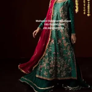 Emerald Green Floral Embroidered Anarkali Sharara Suit Step into timeless elegance with the Emerald Gulab Royale Anarkali, a stunning emerald green embroidered sharara suit featuring intricate floral embellishment and a contrasting pink dupatta. This sophisticated ethnic ensemble combines a traditional Indian silhouette with rich colours and graceful detailing, making it an ideal choice for weddings, festive celebrations and special occasions. The emerald green Anarkali-style kurta creates a beautiful flowing silhouette, enhanced with detailed floral embroidery across the front. Delicate motifs are arranged throughout the outfit, adding depth and a luxurious festive appearance. The neckline and sleeve borders feature coordinating embellishment, while the hem is finished with an elegant decorative border. The matching green sharara adds volume and movement to the ensemble. Its wide-leg silhouette beautifully complements the long Anarkali kurta and creates a graceful traditional look. Subtle border detailing at the bottom provides a polished finish. The highlight of this outfit is the rich pink dupatta, which creates a beautiful contrast against the emerald green base. Its embellished edging adds sophistication and brings the entire colour palette together. The combination of emerald green, pink and gold-inspired detailing gives this outfit a regal and celebratory character. This embroidered Anarkali sharara suit for women is perfect for women who love traditional Indian ethnic wear with a statement colour combination. Style it for a wedding guest look, mehndi ceremony, sangeet, engagement celebration, festive dinner, Diwali celebration or family function. Key Features Rich emerald green colour Contrasting pink dupatta Anarkali-style long kurta Matching wide-leg sharara Floral embroidered detailing Embellished neckline Detailed sleeve borders Decorative hem border Coordinated dupatta border Elegant festive silhouette Suitable for wedding and party wear Styling Suggestions Pair this green Anarkali sharara suit with gold jhumkas, statement earrings, traditional bangles and embellished footwear. A pink or gold potli bag can complement the dupatta beautifully. For a wedding or sangeet, choose heavier jewellery such as a statement necklace and chandbali earrings. For a more understated festive appearance, pair the outfit with minimal earrings, bangles and metallic heels. A sleek bun, soft curls or a traditional braided hairstyle can complete the look. Gold, champagne or soft pink makeup tones can beautifully complement the emerald-and-pink colour combination. Perfect For This outfit is suitable for weddings, mehndi ceremonies, sangeet functions, engagement parties, festive celebrations, Diwali gatherings, family functions, wedding guest occasions, traditional parties and evening events. Its elegant colour combination also makes it a beautiful option for women looking for an Indian ethnic outfit for weddings in the USA, UK, Canada or Australia. Why Choose the Emerald Gulab Royale? The Emerald Green Floral Embroidered Anarkali Sharara Suit brings together a classic silhouette and a vibrant colour combination. Emerald green gives the outfit a sophisticated appearance, while the pink dupatta introduces a feminine contrast. The flowing Anarkali kurta and wide sharara create an elegant silhouette that moves beautifully, while the embroidery gives the ensemble an occasion-wear finish. It is a versatile addition to a festive wardrobe and can be accessorised differently for daytime and evening celebrations. Whether you are attending a close family wedding, a festive gathering or an elegant evening celebration, this outfit offers a graceful traditional look with a contemporary styling appeal. emerald green anarkali suit, green anarkali sharara suit, green sharara suit, embroidered anarkali suit, embroidered sharara suit, anarkali suit for women, Punjabi sharara suit, Punjabi suits online, green Punjabi suit, wedding sharara suit, wedding guest outfit, festive wear suit, party wear anarkali, floral embroidered suit, green ethnic wear, green Indian outfit, pink dupatta suit, green and pink suit, wedding outfit for women, mehndi outfit, sangeet outfit, engagement outfit, festive Indian wear, traditional Indian suit, ethnic party wear, women sharara suit, anarkali party wear, boutique Punjabi suits, embroidered Punjabi suit, Indian wedding wear, wedding outfits USA, Indian outfits USA, Punjabi suits Canada, Indian ethnic wear UK