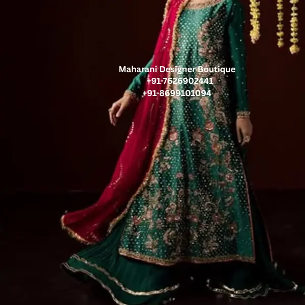 Emerald Green Floral Embroidered Anarkali Sharara Suit Step into timeless elegance with the Emerald Gulab Royale Anarkali, a stunning emerald green embroidered sharara suit featuring intricate floral embellishment and a contrasting pink dupatta. This sophisticated ethnic ensemble combines a traditional Indian silhouette with rich colours and graceful detailing, making it an ideal choice for weddings, festive celebrations and special occasions. The emerald green Anarkali-style kurta creates a beautiful flowing silhouette, enhanced with detailed floral embroidery across the front. Delicate motifs are arranged throughout the outfit, adding depth and a luxurious festive appearance. The neckline and sleeve borders feature coordinating embellishment, while the hem is finished with an elegant decorative border. The matching green sharara adds volume and movement to the ensemble. Its wide-leg silhouette beautifully complements the long Anarkali kurta and creates a graceful traditional look. Subtle border detailing at the bottom provides a polished finish. The highlight of this outfit is the rich pink dupatta, which creates a beautiful contrast against the emerald green base. Its embellished edging adds sophistication and brings the entire colour palette together. The combination of emerald green, pink and gold-inspired detailing gives this outfit a regal and celebratory character. This embroidered Anarkali sharara suit for women is perfect for women who love traditional Indian ethnic wear with a statement colour combination. Style it for a wedding guest look, mehndi ceremony, sangeet, engagement celebration, festive dinner, Diwali celebration or family function. Key Features Rich emerald green colour Contrasting pink dupatta Anarkali-style long kurta Matching wide-leg sharara Floral embroidered detailing Embellished neckline Detailed sleeve borders Decorative hem border Coordinated dupatta border Elegant festive silhouette Suitable for wedding and party wear Styling Suggestions Pair this green Anarkali sharara suit with gold jhumkas, statement earrings, traditional bangles and embellished footwear. A pink or gold potli bag can complement the dupatta beautifully. For a wedding or sangeet, choose heavier jewellery such as a statement necklace and chandbali earrings. For a more understated festive appearance, pair the outfit with minimal earrings, bangles and metallic heels. A sleek bun, soft curls or a traditional braided hairstyle can complete the look. Gold, champagne or soft pink makeup tones can beautifully complement the emerald-and-pink colour combination. Perfect For This outfit is suitable for weddings, mehndi ceremonies, sangeet functions, engagement parties, festive celebrations, Diwali gatherings, family functions, wedding guest occasions, traditional parties and evening events. Its elegant colour combination also makes it a beautiful option for women looking for an Indian ethnic outfit for weddings in the USA, UK, Canada or Australia. Why Choose the Emerald Gulab Royale? The Emerald Green Floral Embroidered Anarkali Sharara Suit brings together a classic silhouette and a vibrant colour combination. Emerald green gives the outfit a sophisticated appearance, while the pink dupatta introduces a feminine contrast. The flowing Anarkali kurta and wide sharara create an elegant silhouette that moves beautifully, while the embroidery gives the ensemble an occasion-wear finish. It is a versatile addition to a festive wardrobe and can be accessorised differently for daytime and evening celebrations. Whether you are attending a close family wedding, a festive gathering or an elegant evening celebration, this outfit offers a graceful traditional look with a contemporary styling appeal. emerald green anarkali suit, green anarkali sharara suit, green sharara suit, embroidered anarkali suit, embroidered sharara suit, anarkali suit for women, Punjabi sharara suit, Punjabi suits online, green Punjabi suit, wedding sharara suit, wedding guest outfit, festive wear suit, party wear anarkali, floral embroidered suit, green ethnic wear, green Indian outfit, pink dupatta suit, green and pink suit, wedding outfit for women, mehndi outfit, sangeet outfit, engagement outfit, festive Indian wear, traditional Indian suit, ethnic party wear, women sharara suit, anarkali party wear, boutique Punjabi suits, embroidered Punjabi suit, Indian wedding wear, wedding outfits USA, Indian outfits USA, Punjabi suits Canada, Indian ethnic wear UK