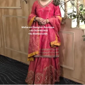 Gulabi Noor Pink Punjabi Sharara Suit Add a touch of traditional Punjabi elegance to your wardrobe with the Gulabi Noor Pink Punjabi Sharara Suit, a beautifully detailed ethnic ensemble featuring a vibrant rose-pink colour, delicate embroidery and elegant golden accents. This graceful outfit brings together the charm of a traditional Punjabi suit with the festive appeal of a beautifully flared sharara-style bottom. The rich pink kurta features delicate scattered motifs across the fabric, while the neckline is highlighted with intricate golden detailing that adds a refined touch to the overall look. The lower hem of the kurta is finished with multiple decorative borders, creating a beautiful transition between the kurta and the flared bottom. The sharara/gharara-style bottom features an elegant embroidered border with traditional floral and ornamental motifs, giving the outfit a distinctive festive appearance. The matching pink dupatta completes the ensemble. Its delicate embroidery and broad golden border add an additional layer of elegance while beautifully complementing the pink base. The combination of pink and gold creates a feminine, celebratory look that works beautifully for weddings, festive gatherings and special occasions. 5. Design Details The Gulabi Noor Sharara Suit is designed around a classic Indian ethnic silhouette with contemporary styling. Kurta The kurta features a beautiful rose-pink base with small scattered embroidered motifs. The neckline has ornate golden detailing that draws attention toward the face while keeping the overall look elegant. The sleeves continue the same colour story and are finished with subtle detailing, creating a coordinated appearance. The lower portion of the kurta features layered decorative borders with gold and metallic accents. These borders give the outfit a traditional Punjabi character and add visual richness without overwhelming the pink base. Sharara / Gharara Bottom The flared bottom creates beautiful movement and gives the outfit its signature festive silhouette. The lower section features prominent embroidered motifs arranged along the border. Floral and ornamental patterns add a traditional touch, while the broad decorative hem creates a luxurious finishing detail. The flare makes this outfit especially attractive when walking, dancing or posing for photographs. Dupatta The matching pink dupatta features delicate embroidery with an elegant golden border. The lightweight-looking drape gives the outfit a graceful appearance and can be styled in several ways. Wear it traditionally over both shoulders, drape it across one shoulder or carry it loosely around the arms for a contemporary festive look. 6. Colour Description The primary shade is a beautiful rose pink / deep pink, complemented with golden and antique-gold detailing. Pink brings a soft and feminine character to the outfit, while the gold accents create a festive and luxurious appearance. This colour combination works particularly well for: Day weddings Mehndi functions Engagement ceremonies Sangeet celebrations Family weddings Festive gatherings Traditional parties Puja celebrations Teej celebrations Karwa Chauth Diwali events Wedding guest outfits 7. Why You'll Love This Punjabi Sharara Suit The Gulabi Noor Pink Punjabi Sharara Suit combines traditional craftsmanship with a graceful silhouette that can be styled for a variety of occasions. Elegant Pink Colour The rich pink shade creates a youthful and feminine appearance while remaining suitable for traditional celebrations. Traditional Embroidery The ornamental embroidery and decorative borders give the ensemble an authentic ethnic character. Flared Silhouette The sharara-style bottom creates movement and adds drama to the outfit. Golden Accents The gold detailing beautifully contrasts with the pink base and makes the outfit suitable for festive occasions. Matching Dupatta The coordinated dupatta completes the outfit and allows you to create both traditional and contemporary looks. 8. Perfect for Weddings Looking for a beautiful Punjabi suit for a wedding? The Gulabi Noor ensemble is an excellent choice for women who want an elegant ethnic outfit without choosing a traditional bridal lehenga. It can be worn by: Wedding guests Bridesmaids Sisters of the bride Sisters of the groom Cousins Mothers Family members Wedding attendees For a daytime wedding, pair it with delicate jewellery and soft makeup. For an evening celebration, add statement earrings, bangles and a more dramatic hairstyle. 9. Perfect for Mehndi & Sangeet The vibrant pink colour and flared silhouette make this outfit particularly suitable for mehndi and sangeet celebrations. For a mehndi function, style it with: Floral jewellery Punjabi juttis Colourful bangles Small earrings Soft curls or a braid For a sangeet, add statement earrings, embellished footwear and a glamorous hairstyle. The flared bottom will also create beautiful movement during dance performances and photographs. 10. Styling Ideas Traditional Punjabi Styling Pair the suit with: Gold jhumkas Punjabi jutti Gold bangles Maang tikka Traditional paranda Soft pink makeup This creates a classic Punjabi festive appearance. Modern Wedding Styling For a contemporary appearance, style the dupatta over one shoulder and pair the suit with: Statement earrings Minimal necklace Heels Sleek hairstyle Soft glam makeup Royal Festive Styling For a more luxurious appearance, combine the outfit with: Kundan jewellery Polki earrings Layered bangles Embellished heels Traditional hair accessories 11. Ideal Jewellery The pink and gold colour combination works beautifully with traditional Indian jewellery. Recommended options include: Kundan Jewellery: Creates a luxurious wedding look. Gold Jewellery: Enhances the warm golden borders. Jhumkas: Perfect for a traditional Punjabi appearance. Chandbali Earrings: Adds a statement element. Maang Tikka: Ideal for wedding and festive occasions. Bangles: Gold, pink, champagne or kundan bangles can complement the outfit beautifully. 12. Indian Wedding Guest Outfit The Gulabi Noor suit is a versatile choice for women searching for an Indian wedding guest outfit. Unlike an extremely heavy bridal outfit, this ensemble offers a balanced combination of colour, embroidery and traditional styling. It allows you to look dressed up while retaining a graceful and comfortable ethnic appearance. It can be styled for daytime ceremonies as well as evening celebrations by simply changing the jewellery, footwear and makeup. 13. Punjabi Suit for USA, Canada & UK For women looking for Punjabi suits online in USA, Canada or UK, this outfit offers a beautiful traditional option for South Asian celebrations. It can be styled for: Punjabi weddings Sikh wedding celebrations Indian wedding events Mehndi parties Sangeet nights Diwali celebrations Eid gatherings Family functions South Asian cultural events The vibrant pink colour and traditional embroidery make it suitable for women who want to maintain a classic Indian ethnic aesthetic while living abroad. 14. Punjabi Sharara Suit for Bridesmaids This outfit can also work beautifully as a bridesmaid sharara suit. If the bride is wearing a traditional red or maroon lehenga, bridesmaids can wear coordinated pink, rose or pastel shades to create a beautiful group appearance. For bridesmaid styling, pair the outfit with matching jewellery and footwear while keeping the makeup elegant and fresh. 15. Occasion Guide Occasion Styling Wedding Gold jewellery + heels Mehndi Floral jewellery + juttis Sangeet Statement earrings + heels Engagement Kundan jewellery Diwali Gold accessories Family Function Minimal jewellery Festive Party Statement bangles Wedding Guest Jhumkas + clutch Teej Traditional jewellery Karwa Chauth Gold jewellery + traditional styling 16. Product Features Rose pink ethnic suit Punjabi-inspired silhouette Flared sharara/gharara-style bottom Delicate scattered embroidery Ornate neckline detailing Decorative kurta border Embroidered lower border Matching pink dupatta Golden border detailing Feminine festive colour palette Suitable for weddings and celebrations Suitable for Indian and South Asian occasions Ideal for wedding guests and bridesmaids Traditional yet versatile styling Fabric & Product Information Colour: Rose Pink / Deep Pink with Golden Detailing Style: Punjabi Sharara Suit / Gharara Style Suit Embroidery: Decorative floral and ornamental embroidery as shown Dupatta: Matching pink dupatta with embroidered detailing and golden border Bottom: Flared sharara/gharara-style silhouette Occasion: Wedding, festive, party and traditional wear Fit: Please confirm available sizes and customization options with Maharani Designer Boutique. Fabric: The exact fabric composition should be confirmed with the boutique before publishing, as fabric type cannot be reliably determined from the photograph alone. Note: Product colour may vary slightly depending on photography, lighting and individual monitor or mobile-screen settings. The Gulabi Noor Pink Punjabi Sharara Suit is a graceful Indian ethnic outfit created for women who appreciate traditional Punjabi fashion with a feminine and festive appearance. Featuring a rich pink base, intricate embroidery, golden borders and a flowing sharara-style bottom, this outfit brings together several timeless elements of Indian occasion wear. The pink kurta is decorated with delicate motifs distributed across the fabric. The detailed neckline adds an elegant focal point, while the embellished lower border provides a traditional finishing touch. The flared sharara creates volume and movement, making the outfit especially attractive for weddings, celebrations and photographs. The matching dupatta adds another layer of elegance. Its embroidered details and golden border coordinate with the rest of the outfit, allowing the complete ensemble to look polished and thoughtfully styled. For women searching for Punjabi suits online, Punjabi sharara suits, wedding guest suits, Indian ethnic outfits, or traditional Punjabi outfits for weddings, this design offers a versatile choice. The outfit can be dressed up or down according to the occasion. For daytime functions, pair it with delicate jewellery and comfortable traditional footwear. For evening celebrations, statement earrings, gold bangles and embellished heels can transform the look into a glamorous wedding ensemble. Its pink-and-gold colour combination also makes it particularly suitable for festive celebrations. Pink provides a vibrant and feminine foundation, while golden accents add warmth and sophistication. Whether you are attending a Punjabi wedding in Canada, a family celebration in the USA, a South Asian wedding in the UK or a festive event in India, this outfit can be styled to suit your personal aesthetic. The Gulabi Noor Punjabi Sharara Suit is more than a festive outfit; it is a celebration of traditional Indian fashion expressed through colour, embroidery, movement and elegant detailing. pink Punjabi suit, Punjabi sharara suit, pink sharara suit, Punjabi suit for wedding, Punjabi suits online, Punjabi suits for women, wedding guest Punjabi suit, Indian wedding outfit, pink Indian ethnic wear, pink wedding suit, Punjabi suit USA, Punjabi suit Canada, Punjabi suit UK, Indian suits USA, Indian suits Canada, Indian suits UK, embroidered Punjabi suit, embroidered sharara suit, festive Punjabi suit, traditional Punjabi outfit, Punjabi wedding outfit, Punjabi party wear suit, women ethnic wear, Indian ethnic wear, wedding guest outfit, bridesmaid Punjabi suit, pink wedding guest outfit, Punjabi sharara online, designer Punjabi suit, Punjabi suit boutique, Maharani Designer Boutique
