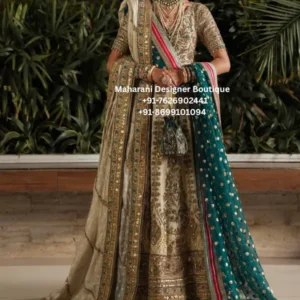Ivory Gold Heritage Embroidered Bridal Lehenga Choli Make a regal statement on your special occasion with the Ivory Gold Heritage Embroidered Bridal Lehenga Choli, an exquisite ivory and gold bridal lehenga choli paired with a luxurious teal dupatta. This traditional-inspired ensemble beautifully combines rich embroidery, intricate borders and statement detailing to create an elegant wedding look. The ivory-gold lehenga features elaborate ornamental embroidery throughout the skirt, creating a luxurious surface with a beautifully detailed hemline. Rich gold embellishment adds depth and dimension, while the ivory base gives the outfit a timeless and sophisticated appearance. The matching blouse is crafted with detailed embroidery and short sleeves, complementing the grandeur of the lehenga while maintaining a refined silhouette. The neckline and sleeves are enhanced with ornate detailing, giving the choli a traditional bridal character. The standout feature of this ensemble is the deep teal dupatta, beautifully decorated with gold motifs and an elaborate embroidered border. The contrasting teal shade creates a striking visual balance against the ivory and gold lehenga. A second ivory-toned drape with an embellished border adds another layer of richness and can be styled elegantly over the shoulder. This heavy embroidered bridal lehenga choli is an ideal choice for brides, bridesmaids and women attending luxurious wedding celebrations. The combination of ivory, antique gold and teal makes it suitable for traditional ceremonies, reception celebrations, engagement functions and grand festive occasions. Key Features • Ivory and antique-gold colour palette • Contrasting teal dupatta • Heavily embroidered lehenga skirt • Intricately embellished blouse • Ornate traditional embroidery • Detailed borders and hemline • Gold floral and ornamental motifs • Rich bridal finishing • Coordinated dupattas for a layered look • Elegant traditional Indian silhouette Perfect for Bridal & Wedding Occasions The Teal Royale Heritage Lehenga is designed for occasions where you want your outfit to feel luxurious and memorable. It can be worn for a wedding ceremony, reception, engagement, sangeet, mehndi, roka, anniversary celebration or grand festive event. The ivory and gold combination offers a timeless bridal appearance, while the teal dupatta introduces a contemporary colour contrast. The ensemble can be accessorised with kundan jewellery, emerald-inspired jewellery, polki pieces or traditional gold ornaments. Styling Suggestions Complete the look with: • Kundan or polki bridal jewellery • Emerald or teal statement necklace • Traditional maang tikka • Jhumka or chandbali earrings • Embellished potli bag • Gold or metallic footwear • Traditional bridal bangles • Elegant updo or braided hairstyle For a classic bridal appearance, drape the teal dupatta over one shoulder and allow the embroidered border to fall naturally. Alternatively, style the ivory dupatta over the head for a more traditional ceremony-ready look. Ideal For: Bridal wedding wear, reception outfit, engagement lehenga, sangeet outfit, mehndi celebration, bridesmaid lehenga, wedding guest outfit, festive wear, luxury ethnic wear and traditional Indian celebrations.  ivory bridal lehenga, gold bridal lehenga, teal dupatta lehenga, ivory gold lehenga choli, bridal lehenga choli, heavy embroidered bridal lehenga, wedding lehenga for bride, designer bridal lehenga, traditional bridal lehenga, embroidered lehenga choli, wedding outfit for women, bridal outfit online, Indian bridal lehenga, luxury bridal lehenga, wedding lehenga online, ivory lehenga for wedding, gold embroidered lehenga, teal bridal lehenga, teal and gold lehenga, heavy handwork lehenga, bridal wear for women, engagement lehenga, reception lehenga, sangeet lehenga, mehndi lehenga, bridesmaid lehenga, ethnic wedding wear, boutique bridal lehenga, bridal lehenga USA, bridal lehenga Canada, bridal lehenga UK