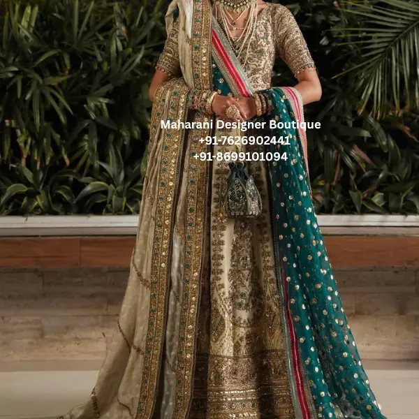 Ivory Gold Heritage Embroidered Bridal Lehenga Choli Make a regal statement on your special occasion with the Ivory Gold Heritage Embroidered Bridal Lehenga Choli, an exquisite ivory and gold bridal lehenga choli paired with a luxurious teal dupatta. This traditional-inspired ensemble beautifully combines rich embroidery, intricate borders and statement detailing to create an elegant wedding look. The ivory-gold lehenga features elaborate ornamental embroidery throughout the skirt, creating a luxurious surface with a beautifully detailed hemline. Rich gold embellishment adds depth and dimension, while the ivory base gives the outfit a timeless and sophisticated appearance. The matching blouse is crafted with detailed embroidery and short sleeves, complementing the grandeur of the lehenga while maintaining a refined silhouette. The neckline and sleeves are enhanced with ornate detailing, giving the choli a traditional bridal character. The standout feature of this ensemble is the deep teal dupatta, beautifully decorated with gold motifs and an elaborate embroidered border. The contrasting teal shade creates a striking visual balance against the ivory and gold lehenga. A second ivory-toned drape with an embellished border adds another layer of richness and can be styled elegantly over the shoulder. This heavy embroidered bridal lehenga choli is an ideal choice for brides, bridesmaids and women attending luxurious wedding celebrations. The combination of ivory, antique gold and teal makes it suitable for traditional ceremonies, reception celebrations, engagement functions and grand festive occasions. Key Features • Ivory and antique-gold colour palette • Contrasting teal dupatta • Heavily embroidered lehenga skirt • Intricately embellished blouse • Ornate traditional embroidery • Detailed borders and hemline • Gold floral and ornamental motifs • Rich bridal finishing • Coordinated dupattas for a layered look • Elegant traditional Indian silhouette Perfect for Bridal & Wedding Occasions The Teal Royale Heritage Lehenga is designed for occasions where you want your outfit to feel luxurious and memorable. It can be worn for a wedding ceremony, reception, engagement, sangeet, mehndi, roka, anniversary celebration or grand festive event. The ivory and gold combination offers a timeless bridal appearance, while the teal dupatta introduces a contemporary colour contrast. The ensemble can be accessorised with kundan jewellery, emerald-inspired jewellery, polki pieces or traditional gold ornaments. Styling Suggestions Complete the look with: • Kundan or polki bridal jewellery • Emerald or teal statement necklace • Traditional maang tikka • Jhumka or chandbali earrings • Embellished potli bag • Gold or metallic footwear • Traditional bridal bangles • Elegant updo or braided hairstyle For a classic bridal appearance, drape the teal dupatta over one shoulder and allow the embroidered border to fall naturally. Alternatively, style the ivory dupatta over the head for a more traditional ceremony-ready look. Ideal For: Bridal wedding wear, reception outfit, engagement lehenga, sangeet outfit, mehndi celebration, bridesmaid lehenga, wedding guest outfit, festive wear, luxury ethnic wear and traditional Indian celebrations. ivory bridal lehenga, gold bridal lehenga, teal dupatta lehenga, ivory gold lehenga choli, bridal lehenga choli, heavy embroidered bridal lehenga, wedding lehenga for bride, designer bridal lehenga, traditional bridal lehenga, embroidered lehenga choli, wedding outfit for women, bridal outfit online, Indian bridal lehenga, luxury bridal lehenga, wedding lehenga online, ivory lehenga for wedding, gold embroidered lehenga, teal bridal lehenga, teal and gold lehenga, heavy handwork lehenga, bridal wear for women, engagement lehenga, reception lehenga, sangeet lehenga, mehndi lehenga, bridesmaid lehenga, ethnic wedding wear, boutique bridal lehenga, bridal lehenga USA, bridal lehenga Canada, bridal lehenga UK