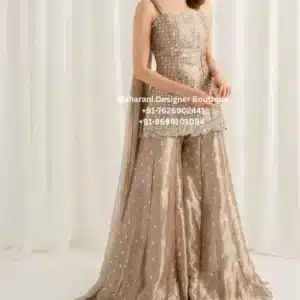 Royal Champagne Embroidered Sharara Suit Set Celebrate every special occasion with the elegance of the Royal Champagne Embroidered Sharara Suit Set, exclusively crafted for women who appreciate luxury, craftsmanship, and timeless ethnic fashion. Moreover, this premium designer outfit combines intricate embroidery, a contemporary sleeveless kurti, a beautifully flared sharara, and a matching embroidered dupatta to create an effortlessly graceful look. The sophisticated champagne gold shade reflects luxury and refinement. Furthermore, the delicate embroidery adds sparkle and texture, making this ensemble perfect for weddings, receptions, engagement ceremonies, festive celebrations, and evening parties. As a result, you enjoy an outfit that is both fashionable and timeless. Whether you're attending a wedding in London, celebrating Diwali in Toronto, or dressing for a reception in New York, this designer sharara suit ensures you look elegant from every angle. Exquisite Embroidery Every detail of this sharara suit is designed with precision. Additionally, the kurti features intricate embroidery that creates a luxurious appearance without overpowering the overall design. In addition, elegant embellishments continue across the sharara and dupatta, giving the entire outfit a coordinated boutique finish. Therefore, each piece reflects premium craftsmanship and attention to detail. Elegant Sleeveless Kurti The fitted sleeveless kurti offers a modern silhouette while maintaining traditional elegance. Features Elegant square neckline Premium embroidery Comfortable fit Fine boutique stitching Contemporary silhouette Lightweight fabric Luxury finish Furthermore, Luxury Champagne Gold Embroidered Sharara Suit the flattering cut enhances comfort while creating a graceful and sophisticated appearance. Designer Sharara Bottom The flowing sharara adds movement and elegance to every step. Features Wide flared silhouette Premium fabric Delicate embellishments Comfortable waistband Beautiful drape Lightweight feel As a result, the sharara creates a stunning look that is perfect for wedding celebrations and festive occasions. Matching Embroidered Dupatta The coordinating dupatta completes the outfit beautifully. Moreover, the elegant border detailing and delicate embellishments complement the embroidery on the kurti and sharara. Consequently, the complete ensemble looks luxurious and balanced. Perfect for Every Occasion This designer sharara suit is ideal for: Wedding Functions Reception Parties Engagement Ceremony Mehndi Sangeet Eid Celebrations Diwali Karwa Chauth Raksha Bandhan Family Gatherings Anniversary Celebrations Cocktail Parties Destination Weddings Cultural Events Festive Occasions Finally, its timeless elegance makes it a valuable addition to every luxury ethnic wardrobe. Style It with Confidence Pair this beautiful outfit with: Diamond jewellery Kundan earrings Pearl accessories Crystal heels Embellished clutch Soft glam makeup Elegant curls Likewise, keeping accessories minimal allows the intricate embroidery to remain the highlight of your look. Why You'll Love This Outfit Elegant champagne gold colour Premium embroidery Contemporary sharara silhouette Boutique-quality craftsmanship Comfortable all-day wear Lightweight luxury fabric Perfect for weddings and festive occasions Worldwide shipping available Perfect for Customers in the UK, USA & Canada Created for women who appreciate premium ethnic fashion, this sharara suit is ideal for customers searching for designer sharara suits in the UK, luxury Indian outfits in the USA, and boutique festive wear in Canada. Moreover, its elegant design makes it perfect for multicultural weddings and grand celebrations around the world. Care Instructions Dry clean only Steam iron on low heat Store in a garment bag Protect embellished areas during storage Avoid bleach and harsh detergents Why Choose Maharani Designer Boutique? At Maharani Designer Boutique, every outfit is thoughtfully designed to combine traditional craftsmanship with modern elegance. Moreover, we use premium fabrics, detailed embroidery, and expert tailoring to create luxury ethnic wear that stands out. Our exclusive collections are loved by customers across the UK, USA, Canada, Australia, and Europe, making every celebration unforgettable with timeless boutique fashion. Champagne Gold Sharara Suit, Designer Sharara Suit, Embroidered Sharara Set, Luxury Sharara Suit, Wedding Sharara Outfit, Party Wear Sharara Suit, Boutique Sharara Set, Indian Ethnic Wear UK, Indian Clothing USA, Indian Boutique Canada, Designer Festive Wear, Women's Luxury Ethnic Outfit, Wedding Guest Outfit, Reception Wear Sharara, Maharani Designer Boutique.