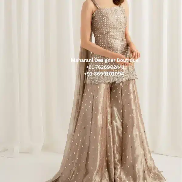 Royal Champagne Embroidered Sharara Suit Set Celebrate every special occasion with the elegance of the Royal Champagne Embroidered Sharara Suit Set, exclusively crafted for women who appreciate luxury, craftsmanship, and timeless ethnic fashion. Moreover, this premium designer outfit combines intricate embroidery, a contemporary sleeveless kurti, a beautifully flared sharara, and a matching embroidered dupatta to create an effortlessly graceful look. The sophisticated champagne gold shade reflects luxury and refinement. Furthermore, the delicate embroidery adds sparkle and texture, making this ensemble perfect for weddings, receptions, engagement ceremonies, festive celebrations, and evening parties. As a result, you enjoy an outfit that is both fashionable and timeless. Whether you're attending a wedding in London, celebrating Diwali in Toronto, or dressing for a reception in New York, this designer sharara suit ensures you look elegant from every angle. Exquisite Embroidery Every detail of this sharara suit is designed with precision. Additionally, the kurti features intricate embroidery that creates a luxurious appearance without overpowering the overall design. In addition, elegant embellishments continue across the sharara and dupatta, giving the entire outfit a coordinated boutique finish. Therefore, each piece reflects premium craftsmanship and attention to detail. Elegant Sleeveless Kurti The fitted sleeveless kurti offers a modern silhouette while maintaining traditional elegance. Features Elegant square neckline Premium embroidery Comfortable fit Fine boutique stitching Contemporary silhouette Lightweight fabric Luxury finish Furthermore, Luxury Champagne Gold Embroidered Sharara Suit the flattering cut enhances comfort while creating a graceful and sophisticated appearance. Designer Sharara Bottom The flowing sharara adds movement and elegance to every step. Features Wide flared silhouette Premium fabric Delicate embellishments Comfortable waistband Beautiful drape Lightweight feel As a result, the sharara creates a stunning look that is perfect for wedding celebrations and festive occasions. Matching Embroidered Dupatta The coordinating dupatta completes the outfit beautifully. Moreover, the elegant border detailing and delicate embellishments complement the embroidery on the kurti and sharara. Consequently, the complete ensemble looks luxurious and balanced. Perfect for Every Occasion This designer sharara suit is ideal for: Wedding Functions Reception Parties Engagement Ceremony Mehndi Sangeet Eid Celebrations Diwali Karwa Chauth Raksha Bandhan Family Gatherings Anniversary Celebrations Cocktail Parties Destination Weddings Cultural Events Festive Occasions Finally, its timeless elegance makes it a valuable addition to every luxury ethnic wardrobe. Style It with Confidence Pair this beautiful outfit with: Diamond jewellery Kundan earrings Pearl accessories Crystal heels Embellished clutch Soft glam makeup Elegant curls Likewise, keeping accessories minimal allows the intricate embroidery to remain the highlight of your look. Why You'll Love This Outfit Elegant champagne gold colour Premium embroidery Contemporary sharara silhouette Boutique-quality craftsmanship Comfortable all-day wear Lightweight luxury fabric Perfect for weddings and festive occasions Worldwide shipping available Perfect for Customers in the UK, USA & Canada Created for women who appreciate premium ethnic fashion, this sharara suit is ideal for customers searching for designer sharara suits in the UK, luxury Indian outfits in the USA, and boutique festive wear in Canada. Moreover, its elegant design makes it perfect for multicultural weddings and grand celebrations around the world. Care Instructions Dry clean only Steam iron on low heat Store in a garment bag Protect embellished areas during storage Avoid bleach and harsh detergents Why Choose Maharani Designer Boutique? At Maharani Designer Boutique, every outfit is thoughtfully designed to combine traditional craftsmanship with modern elegance. Moreover, we use premium fabrics, detailed embroidery, and expert tailoring to create luxury ethnic wear that stands out. Our exclusive collections are loved by customers across the UK, USA, Canada, Australia, and Europe, making every celebration unforgettable with timeless boutique fashion. Champagne Gold Sharara Suit, Designer Sharara Suit, Embroidered Sharara Set, Luxury Sharara Suit, Wedding Sharara Outfit, Party Wear Sharara Suit, Boutique Sharara Set, Indian Ethnic Wear UK, Indian Clothing USA, Indian Boutique Canada, Designer Festive Wear, Women's Luxury Ethnic Outfit, Wedding Guest Outfit, Reception Wear Sharara, Maharani Designer Boutique.