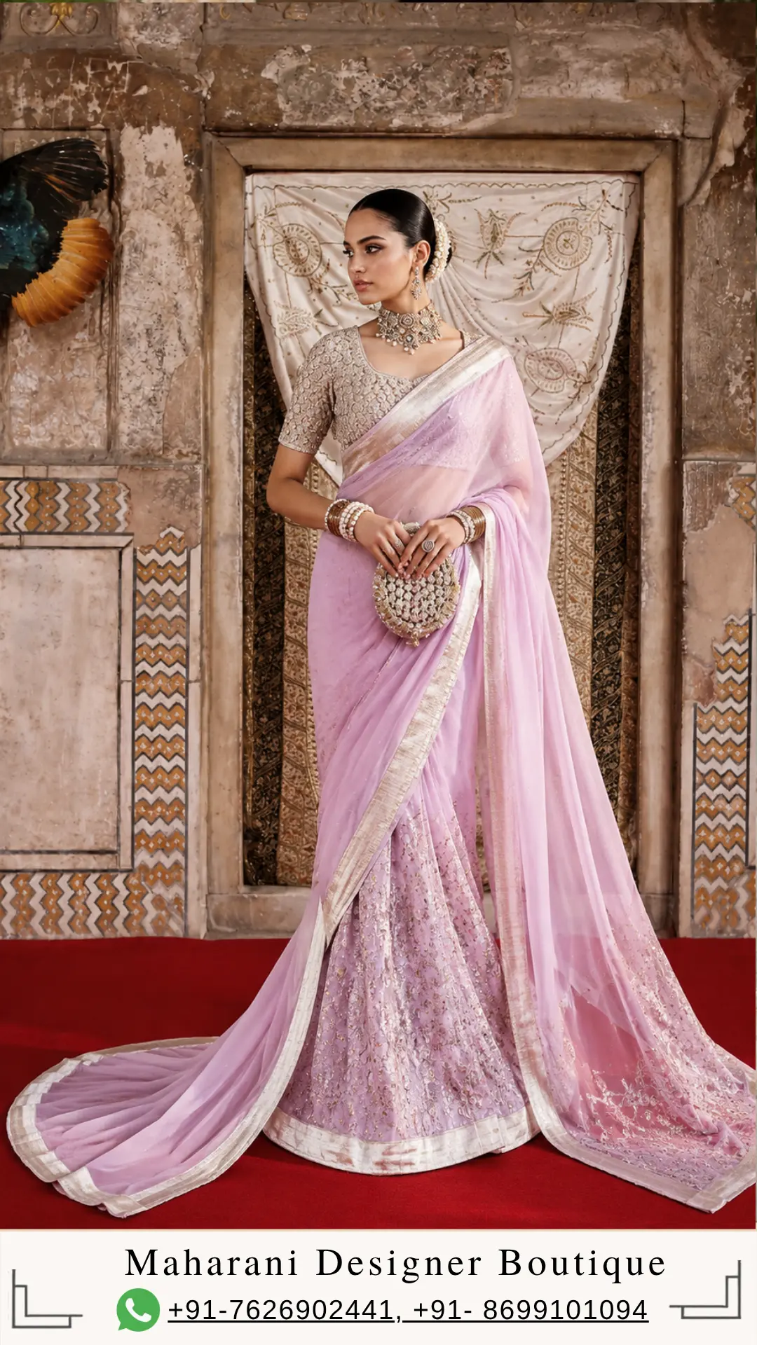 Pastel Pink Designer Saree – Elegant Indian Couture for Weddings & Special Occasions Step into timeless elegance with this Pastel Pink Designer Saree with Embroidered Blouse, a sophisticated creation designed for women who appreciate graceful silhouettes, delicate detailing, and refined Indian couture. Featuring a soft pastel pink colour palette, an intricately embellished blouse, an elegant saree drape, and a beautifully detailed lower section, this ensemble brings together traditional Indian craftsmanship and contemporary luxury styling. The delicate pastel pink shade creates a soft, feminine appearance while allowing the intricate detailing of the outfit to become the centre of attention. The saree is finished with an elegant metallic-toned border that beautifully defines the drape and adds a subtle luxurious touch. The coordinated blouse features detailed embroidery and embellishment, creating a polished look that works beautifully for weddings, receptions, engagement celebrations, festive gatherings, cocktail evenings, and sophisticated social occasions. Designed by Maharani Designer Boutique, this outfit reflects the beauty of Indian occasion wear where colour, craftsmanship, silhouette, and finishing come together to create a memorable ensemble. Whether you are looking for a designer saree for a wedding, a pastel saree for a reception, or an elegant Indian outfit for a special celebration, this design offers a luxurious and graceful choice. A Soft Pastel Pink That Makes a Statement Pastel pink continues to be one of the most elegant colour choices for contemporary Indian occasion wear. Unlike brighter shades that create an instantly dramatic appearance, pastel pink brings softness, sophistication, and understated glamour to your overall look. This particular shade works beautifully with the detailed embellishments of the ensemble. The light pink base creates a refined canvas against which the intricate embroidery and border detailing stand out naturally. It is a colour that can transition effortlessly from daytime celebrations to evening events depending on how you style your jewellery, makeup, hairstyle, and accessories. For women who want a pastel pink saree for a wedding, this design offers a graceful alternative to traditional reds, maroons, and deeper jewel tones. It can also be an excellent choice for engagement functions, wedding receptions, sangeet celebrations, festive dinners, anniversary celebrations, and elegant family occasions. The softness of the colour makes the ensemble especially suitable for women who prefer a sophisticated appearance without excessive visual heaviness. Intricately Embellished Designer Blouse The blouse is one of the defining features of this ensemble. Designed with detailed embellishment throughout the bodice and sleeves, it adds richness to the otherwise soft pastel colour story. The intricate patterning creates a beautifully textured appearance and gives the blouse a couture-inspired finish. The short-sleeved silhouette complements the saree drape while maintaining a classic Indian aesthetic. The neckline is designed to create a graceful frame around the face and neck, making the blouse especially suitable for statement jewellery. Pair it with a traditional choker, layered necklace, chandbali earrings, or elegant drop earrings for a more elevated wedding look. The blouse detailing also ensures that the outfit looks beautiful even when the saree pallu is styled in a different way. For occasions where you want the blouse to become more visible, the saree can be draped to highlight its embroidery and neckline. At Maharani Designer Boutique, designs can be developed with attention to the individual customer's preferred fit, styling requirements, and occasion, subject to the specific product and customisation selected. Elegant Saree Drape The saree has been styled in a fluid drape that creates an effortlessly feminine silhouette. The lightweight visual appearance of the drape allows the pastel pink colour to flow naturally around the body while the structured border gives definition to the overall ensemble. The border is an important element of the design. Its metallic-toned finish contrasts subtly with the pastel base and creates a sophisticated outline along the saree. As the border moves across the shoulder, front, and lower drape, it gives the outfit a beautifully finished appearance. The pallu falls gracefully from the shoulder and extends towards the floor, creating an elegant elongated silhouette. This makes the ensemble particularly suitable for photographs, wedding entrances, receptions, and formal celebrations where the overall presentation of the outfit matters. The saree can be styled traditionally or adapted to suit a more contemporary draping preference. Detailed Lower Panel for a Couture-Inspired Appearance One of the most striking elements of this ensemble is the richly detailed lower portion visible beneath the saree drape. The coordinated pastel-toned panel features intricate floral-inspired embellishment that adds depth, texture, and visual interest to the outfit. This detailing creates a beautiful contrast between the softer flowing saree and the more structured embroidered section underneath. The result is a layered appearance that resembles the sophistication of modern couture while retaining the timeless identity of a traditional Indian saree. The lower detailing also creates movement when walking, making the outfit particularly attractive for special occasions and photography. The overall composition is carefully balanced. The pastel pink colour keeps the design elegant and feminine, while the embroidery, embellishment, and border provide enough richness for a luxury occasion. Perfect for Weddings and Receptions This designer pink saree can be styled for several wedding-related occasions. Its soft colour and intricate detailing make it versatile enough to work for both daytime and evening celebrations. Wear it for a wedding reception with statement jewellery and a sleek hairstyle for a sophisticated appearance. For an engagement ceremony, pair it with delicate jewellery and soft makeup to highlight the pastel tones. For a sangeet or festive evening, you can add more dramatic earrings, a statement clutch, and glamorous makeup. The same outfit can also work beautifully for an intimate wedding celebration where you want to look elegant without choosing a heavily traditional bridal colour. This design can also be considered for: Wedding receptions Engagement ceremonies Sangeet celebrations Mehendi functions Cocktail evenings Festive celebrations Family weddings Anniversary celebrations Luxury dinner events Fashion events Traditional celebrations Destination wedding functions Pre-wedding celebrations Formal Indian occasions Jewellery Styling The right jewellery can transform the overall personality of this saree. For a traditional wedding appearance, style the pastel pink saree with a statement choker and matching earrings. The embellished blouse provides the perfect foundation for jewellery that sits around the neckline. If you prefer a more contemporary look, choose long drop earrings and skip the necklace. This allows the blouse detailing and neckline to remain visible while creating a clean and sophisticated appearance. Pearl-inspired jewellery can complement the softness of pastel pink beautifully. Traditional gold-toned jewellery can create a richer Indian aesthetic, while diamond-inspired or crystal jewellery can make the outfit feel more modern and glamorous. Bangles can be stacked for a traditional wedding appearance, while a smaller selection of bracelets can create a more contemporary styling. Hairstyle Suggestions A sleek bun is an elegant choice for this saree, especially when paired with statement earrings and a traditional jewellery set. A low bun decorated with flowers can create a graceful Indian wedding appearance. For a more modern look, wear your hair in soft waves or a polished low ponytail. These styles allow the saree and blouse detailing to remain the focus. A centre-parted hairstyle with a neat bun can give the outfit a classic traditional character, while a side-parted hairstyle can make the overall appearance feel softer and more contemporary. Makeup Styling Pastel pink outfits pair beautifully with fresh, luminous makeup. A soft neutral or pink-toned eyeshadow can complement the colour palette without overpowering the outfit. Defined eyes, natural-looking skin, softly sculpted cheeks, and a rosy or nude-pink lip can create an elegant daytime appearance. For an evening reception, you can intensify the eye makeup slightly and add a more luminous finish. A soft pink, mauve, nude, or rose-toned lipstick can work beautifully with the pastel colour story. The goal is to keep the makeup balanced so that the intricate blouse and saree detailing remain the visual focus. Why Choose a Designer Saree? A designer saree is more than simply a traditional garment. It is a carefully developed combination of colour, silhouette, embroidery, embellishment, draping, and finishing. This pastel pink ensemble demonstrates how traditional Indian dressing can be interpreted through a modern luxury lens. Instead of relying solely on heavy colours or excessive embellishment, the design uses a soft colour palette and detailed craftsmanship to create an elegant statement. For women searching for a designer saree online, the most important consideration is often the balance between appearance and versatility. An outfit that looks beautiful in photographs but is difficult to style may have limited practical value. This design offers several styling possibilities, allowing you to personalise the final appearance through jewellery, makeup, hairstyle, and draping. Ideal for the Modern Indian Woman Today's Indian woman often wants traditional clothing that feels sophisticated, comfortable, and contemporary at the same time. This pastel pink saree captures that balance. It retains the classic elegance of a saree while incorporating a refined colour palette and couture-inspired detailing. It can be styled for a traditional family wedding or a modern reception. It can be paired with classic jewellery or contemporary accessories. It can be presented with a traditional hairstyle or a modern beauty look. This versatility makes it a valuable addition to an occasion-wear wardrobe. A Beautiful Choice for Reception Wear Reception outfits often require a slightly more glamorous approach than daytime wedding clothing. This pastel pink designer saree is particularly suited to reception styling because the colour remains sophisticated while the embroidery and embellishment provide the required richness. For a glamorous reception appearance, style the saree with statement earrings, a sleek hairstyle, luminous makeup, and an embellished clutch. For a more understated reception look, choose minimal jewellery and let the blouse embroidery and saree border provide the visual interest. The result can be elegant, sophisticated, and effortlessly photogenic. Custom-Made Styling at Maharani Designer Boutique Maharani Designer Boutique specialises in creating elegant Indian occasion wear with an emphasis on craftsmanship, detailed finishing, and personalised styling. For customers who prefer a made-to-measure experience, selected designs can be customised according to measurements, preferred fitting, styling requirements, and occasion, depending on the product. Customisation can be discussed for elements such as blouse fitting, sleeve preferences, neckline preferences, styling, and other design requirements where applicable. If you are purchasing an outfit for a specific wedding date, it is recommended to discuss your event date and requirements with the boutique in advance so that the appropriate production timeline can be confirmed. Designer Saree for Indian Weddings Indian weddings are celebrations where clothing becomes an important part of the occasion. From the bride and bridesmaids to family members and wedding guests, every celebration creates an opportunity to express personal style. A pastel pink saree offers a sophisticated option for women who want something elegant and luxurious without choosing a conventional bridal-red palette. The colour is especially attractive for wedding guests, mothers of the bride or groom, sisters, cousins, bridesmaids, and women attending formal wedding receptions. Its timeless colour story also makes it less dependent on seasonal trends, allowing it to remain relevant beyond a single wedding season. Perfect for Festive Dressing Although this outfit is ideal for weddings, it is not limited to bridal occasions. The elegant colour and detailed craftsmanship make it suitable for festive celebrations such as Diwali gatherings, family celebrations, cultural events, formal dinners, and special occasions. Depending on the accessories, the same saree can look traditional, contemporary, glamorous, or understated. This adaptability makes it a beautiful choice for women who prefer investing in carefully designed occasion wear rather than selecting outfits for only one specific event. Styling for Destination Weddings Pastel shades are particularly beautiful for destination wedding photography. Whether the celebration takes place in a heritage venue, luxury hotel, palace-inspired setting, or outdoor wedding location, pastel pink creates a soft and sophisticated visual effect. The saree's flowing drape and detailed lower panel can add movement to photographs, while the embellished blouse creates a polished appearance in close-up portraits. For destination wedding styling, pair the ensemble with lightweight statement jewellery, a structured clutch, and a sleek hairstyle. A Timeless Addition to Your Wardrobe Fashion trends change, but certain silhouettes and colours remain timeless. The saree is one of India's most enduring garments, and pastel shades have become increasingly popular among modern women looking for elegant occasion wear. This ensemble combines both elements. Its traditional saree silhouette ensures timeless appeal, while the pastel pink palette and refined embellishment provide a contemporary finish. Whether worn this wedding season or styled years later for another celebration, the design can remain a sophisticated part of your occasion wardrobe. Quality and Craftsmanship At Maharani Designer Boutique, the beauty of an outfit lies not only in its visual appearance but also in the craftsmanship behind the finished garment. Intricate embroidery and embellishment require careful attention to placement, balance, and finishing. The overall design is created to ensure that the detailing complements the silhouette rather than overwhelming it. The result is an ensemble that feels luxurious while maintaining an elegant visual balance. Please note that the exact fabric composition, embroidery technique, embellishment materials, and customisation options may vary according to the final product version. Customers are encouraged to confirm product specifications, availability, measurements, and customisation requirements with the boutique before placing an order. Shop Designer Sarees Online If you are searching for designer sarees online, Indian designer sarees, wedding sarees, or pastel pink sarees for special occasions, this ensemble offers a sophisticated option for your wardrobe. Maharani Designer Boutique provides personalised assistance for customers looking for premium Indian occasion wear. Whether you are shopping from Jalandhar, another city in India, or overseas, you can discuss your preferred design, measurements, event requirements, and delivery needs with the boutique. The boutique also caters to customers looking for Indian ethnic wear for weddings and celebrations across different locations. Suitable for Global Indian Celebrations Indian fashion has become an important part of celebrations around the world. Weddings, receptions, Diwali parties, cultural gatherings, engagement functions, and family events are celebrated by Indian communities across Canada, the USA, the UK, Australia, New Zealand, and other countries. A sophisticated saree like this can be an excellent choice for customers living outside India who want authentic Indian occasion wear with a contemporary aesthetic. The soft pastel palette also works particularly well for international wedding settings, where Indian traditional clothing can be styled alongside modern luxury fashion. Final Styling Inspiration Imagine this pastel pink designer saree paired with a statement choker, delicate earrings, stacked bangles, a sleek low bun, glowing makeup, and an embellished clutch. For a daytime event, keep the styling soft and elegant. For an evening reception, increase the jewellery and add a more glamorous makeup look. For a destination wedding, choose lightweight accessories and let the flowing saree drape create movement. For an intimate family celebration, keep the jewellery minimal and allow the detailed blouse and border to speak for themselves. The possibilities are endless because the design itself provides a sophisticated foundation for personal styling. Order Your Pastel Pink Designer Saree Make your next celebration memorable with a beautifully detailed Pastel Pink Designer Saree with Embroidered Blouse, created for women who appreciate elegance, craftsmanship, and sophisticated Indian fashion. From the soft pastel colour to the intricate blouse detailing, flowing saree drape, elegant border, and richly embellished lower section, every element contributes to a refined occasion-wear aesthetic. Whether you are attending a wedding reception, engagement, sangeet, festive celebration, or another special event, this designer saree offers a graceful and luxurious way to make an impression. Explore the latest collection from Maharani Designer Boutique and discover thoughtfully designed Indian ethnic wear created for memorable occasions. For product availability, measurements, customisation, pricing, production timeline, and shipping details, contact the boutique directly before placing your order. Maharani Designer Boutique Jalandhar, Punjab, India Worldwide & PAN India shipping available WhatsApp: +91 7626902441 | +91 8699101094 Product Highlights Pastel pink designer saree ensemble Intricately embellished blouse Elegant metallic-toned saree border Detailed lower embroidered panel Sophisticated feminine colour palette Ideal for weddings and receptions Suitable for engagement and sangeet functions Perfect for festive and formal occasions Contemporary interpretation of traditional Indian saree styling Customisation may be available depending on requirements Suitable for Indian and international customers Designed by Maharani Designer Boutique Pastel pink saree, pastel pink designer saree, designer saree, designer sarees online, wedding saree, wedding sarees online, reception saree, designer wedding saree, Indian designer saree, luxury saree, party wear saree, embroidered saree, embroidered blouse saree, pink saree for wedding, pastel saree for wedding, designer saree for reception, Indian ethnic wear, luxury Indian clothing, designer boutique sarees, saree boutique in Jalandhar, designer boutique Jalandhar, Indian designer wear, wedding guest saree, engagement saree, sangeet saree, festive saree, premium saree, custom made saree, designer saree India, Maharani Designer Boutique.