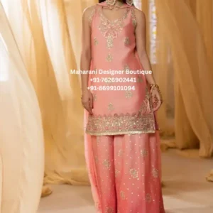 Peach Blossom Embroidered Sharara Suit Add a graceful touch of traditional elegance to your wardrobe with the Peach Blossom Embroidered Sharara Suit , a sophisticated peach-pink ethnic outfit created for festive celebrations, wedding functions, parties and special occasions. This beautiful women’s sharara suit features a soft peach-pink colour palette enhanced with delicate multicolour embroidery and shimmering embellishment, creating a refined and feminine appearance. The outfit showcases a beautifully embellished kurta with intricate embroidery concentrated around the neckline, front panel and hemline. The floral and ornamental motifs add richness while maintaining an elegant overall look. The sleeveless silhouette gives the outfit a contemporary character, making it an appealing choice for women who love traditional Indian fashion with a modern touch. The matching wide-leg sharara pants beautifully complement the kurta. Delicate embroidered motifs and subtle sparkling details are spread across the fabric, while the hemline adds an attractive finishing touch. The coordinated peach-pink colour creates a harmonious silhouette from top to bottom and gives the outfit a graceful flow when worn. A matching dupatta completes the ensemble. Its soft drape adds movement and sophistication, while the embellished detailing coordinates beautifully with the kurta and sharara. The dupatta can be styled over one shoulder, around the neck or in a traditional drape depending on the occasion. The overall look of this embroidered sharara suit for women is elegant, festive and versatile. It can be styled for wedding celebrations, engagement functions, mehndi ceremonies, sangeet nights, festive gatherings, family celebrations and evening parties. The soft peach shade also makes it an excellent choice for daytime celebrations and spring or summer occasions. Peach Pink Sharara Suit Details • Soft peach-pink colour • Embellished embroidered kurta • Contemporary sleeveless kurta silhouette • Wide-leg sharara pants • Matching embellished dupatta • Floral and ornamental embroidery • Delicate shimmering embellishments • Decorative embroidered neckline • Detailed kurta hem • Coordinated sharara embroidery • Elegant ethnic party-wear appearance Perfect for Weddings and Festive Occasions This peach pink sharara suit is an ideal option for women looking for an elegant outfit for wedding-related celebrations. Wear it to a mehndi ceremony with statement earrings and embellished footwear, or style it for a sangeet celebration with a sleek hairstyle and a traditional clutch. For an engagement party, pair the outfit with delicate jewellery and soft makeup for an understated yet glamorous appearance. It can also be styled for Diwali celebrations, Eid gatherings, family functions, festive dinners and traditional celebrations. Styling Ideas Pair the Peach Blossom Noor Sharara Suit with: • Gold or pearl statement earrings • A delicate necklace or choker • Embellished Punjabi jutti • Metallic heels • Potli bag or embellished clutch • Soft curls or an elegant updo • Peach, nude or rose-toned makeup • Minimal bangles for a sophisticated finish The peach-pink colour works beautifully with gold accessories, allowing you to create a luxurious festive appearance without making the outfit look overly heavy. Why Choose This Sharara Suit? The Peach Blossom Embroidered Sharara Suit combines traditional ethnic styling with a contemporary silhouette. Its soft colour makes it easy to accessorise, while the embroidery adds the festive richness expected from an occasion-wear outfit. The coordinated kurta, sharara and dupatta create a complete ethnic look, making this outfit a convenient choice when you want a polished appearance without having to mix and match separate pieces. Whether you are attending a wedding, celebrating a family occasion or searching for an elegant Punjabi sharara suit, this outfit brings together femininity, traditional detailing and modern styling. Ideal For: Wedding guest outfit, mehndi outfit, sangeet outfit, engagement party, festive wear, Diwali outfit, Eid outfit, family function, party wear, traditional celebration, evening event, festive dinner and special occasions.  peach pink sharara suit, embroidered sharara suit, sharara suit for women, Punjabi sharara suit, party wear sharara suit, wedding sharara suit, festive sharara suit, designer sharara suit, embroidered Punjabi suit, women ethnic wear, Indian wedding outfit for women, wedding guest sharara suit, mehndi outfit for women, sangeet outfit, engagement party outfit, peach Punjabi suit, pink sharara suit, festive Indian outfit, ethnic party wear, traditional sharara suit, embroidered ethnic wear, women party wear suits, sharara suit online, Punjabi suits online, boutique sharara suits, wedding outfits for women, Indian ethnic wear online, embellished sharara suit, peach wedding outfit, festive Punjabi outfit