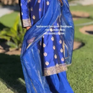 Royal Blue Floral Embroidered Punjabi Salwar Suit Set Discover the timeless beauty of Punjabi fashion with the Royal Blue Floral Embroidered Punjabi Salwar Suit Set, an elegant outfit created for women who love traditional Indian clothing with a refined contemporary appearance. Moreover, the rich royal blue colour immediately gives this ensemble a sophisticated and festive character. The beautifully coordinated kurta, salwar, and dupatta create a complete ethnic look that can effortlessly transition from daytime celebrations to elegant evening occasions. The kurta features delicate floral motifs distributed across the fabric, while the sleeves and lower border are enhanced with intricate decorative detailing. Furthermore, the matching blue dupatta adds another layer of elegance with its lightweight texture and embellished border. As a result, this outfit is an excellent choice for women looking for a graceful Punjabi suit for weddings, festive celebrations, family functions, cultural events, and special occasions. Elegant Royal Blue Colour The standout feature of this Punjabi suit is its rich royal blue colour. Blue is a versatile shade that works beautifully across different occasions and seasons. In addition, royal blue creates a sophisticated contrast with metallic embroidery and traditional embellishments. The colour can be styled with silver, gold, pearl, or statement jewellery. Therefore, you can easily customise the overall appearance according to the occasion. For daytime events, pair the outfit with delicate jewellery and neutral footwear. Meanwhile, for evening celebrations, statement earrings, bangles, and embellished heels can create a more glamorous appearance. Floral Embroidered Kurta The kurta showcases delicate floral motifs that add elegance without making the outfit appear overly heavy. Additionally, the embroidered details are distributed across the front and sleeves, creating a balanced visual appearance. The decorative lower border provides an attractive finishing touch. The design is particularly suitable for women who prefer ethnic clothing that looks elegant while remaining easy to style. Kurta Highlights Rich royal blue colour Floral embroidered motifs Detailed sleeve borders Decorative hemline Traditional Punjabi styling Comfortable silhouette Boutique-inspired finish Furthermore, the classic silhouette allows you to accessorise the outfit in several different ways. Beautiful Dupatta The matching dupatta completes the Punjabi suit beautifully. Moreover, the lightweight blue fabric creates an elegant drape, while the decorative border adds sophistication to the overall outfit. You can style the dupatta in several ways. For example, drape it over one shoulder for a modern appearance, or wear it traditionally across both shoulders for a more classic Punjabi look. Likewise, the flowing texture creates beautiful movement while walking, making the outfit particularly attractive for wedding photographs and festive celebrations. Coordinated Salwar The matching blue salwar completes the traditional Punjabi-inspired appearance. Furthermore, its comfortable construction allows easy movement throughout the day. This makes the outfit suitable for occasions where you may be attending celebrations for several hours. The coordinated colour creates a seamless appearance from the kurta to the lower portion of the outfit. Consequently, the entire ensemble looks polished and well balanced. Perfect for Weddings The Royal Blue Embroidered Punjabi Suit is an excellent choice for wedding celebrations. You can wear it for: Wedding guest outfits Mehndi ceremonies Sangeet functions Engagement parties Family wedding events Reception gatherings Bridal family functions Destination weddings Moreover, the vibrant colour photographs beautifully, making it a wonderful choice for wedding photography and family portraits. Perfect for Festive Celebrations This versatile Punjabi suit can also become a beautiful festive wardrobe essential. Wear it for: Diwali Eid Vaisakhi Karwa Chauth Raksha Bandhan Lohri Navratri Family celebrations Cultural events Festive dinners In addition, its classic silhouette makes it suitable for both traditional and contemporary celebrations. Perfect for Party Wear If you are looking for an elegant ethnic party outfit, this royal blue Punjabi suit offers a sophisticated option. Furthermore, you can elevate the look with statement jewellery, metallic heels, and a coordinated clutch. For a more understated appearance, choose pearl earrings, simple bangles, and traditional juttis. As a result, one outfit can be styled for multiple occasions. Styling Guide Jewellery Royal blue pairs beautifully with several jewellery tones. Consider: Kundan earrings Silver jhumkas Pearl necklace Gold bangles Statement chandbali earrings Traditional Punjabi jewellery Delicate bracelet Moreover, silver jewellery creates a cool, elegant contrast, while gold accessories give the outfit a warmer festive appearance. Footwear Complete your outfit with: Punjabi juttis Embroidered flats Gold heels Silver sandals Block heels Embellished wedges Therefore, you can choose footwear according to both the occasion and comfort level. Hair Styling For a traditional appearance, try a sleek braid or low bun. Alternatively, soft curls can create a more contemporary wedding-guest look. In addition, a simple hair accessory can enhance the festive character of the outfit without competing with the embroidery. Makeup A soft glam makeup look works beautifully with royal blue. Try: Glowing complexion Defined eyes Soft blush Nude or berry lipstick Subtle highlighter Meanwhile, for an evening event, you can add a slightly bolder lip colour and statement eye makeup. Why You'll Love This Punjabi Suit There are several reasons to add this outfit to your ethnic wardrobe. Vibrant Royal Blue Firstly, the rich blue shade creates an elegant and sophisticated appearance. Floral Embroidery Secondly, delicate floral motifs add traditional charm and visual interest. Coordinated Set Thirdly, the matching kurta, salwar, and dupatta make styling simple. Versatile Design Furthermore, the outfit works for weddings, parties, festivals, and family occasions. Easy to Accessorise Finally, the blue colour pairs beautifully with gold, silver, pearl, and traditional jewellery. UK Wedding Wear For customers searching for Punjabi suits in the UK, this royal blue embroidered outfit is a beautiful option for Indian and South Asian celebrations. It can be styled for: London weddings Birmingham celebrations Leicester family functions Southall events Manchester parties Cultural festivals Moreover, the design works well for multicultural wedding celebrations where traditional Indian clothing is paired with contemporary styling. USA Indian Ethnic Wear Customers in the USA looking for elegant Punjabi clothing can style this outfit for weddings, Diwali celebrations, Eid gatherings, cultural events, and family functions. It is suitable for: New York celebrations New Jersey weddings California events Texas family functions Chicago receptions Indian cultural gatherings Furthermore, the royal blue shade gives the outfit a polished appearance that works beautifully for photographs. Canada Punjabi Suit This outfit is also ideal for customers searching for Punjabi suits in Canada. It can be worn for: Toronto weddings Brampton celebrations Mississauga family functions Vancouver events Calgary celebrations Edmonton cultural gatherings In addition, the traditional Punjabi styling makes it a natural choice for Vaisakhi and other cultural celebrations. Product Features Product Type: Punjabi Salwar Suit Colour: Royal Blue Style: Floral Embroidered Ethnic Suit Set Includes: Kurta, Salwar & Dupatta Occasion: Wedding, Party & Festive Wear Embroidery: Floral Decorative Embroidery Style Category: Punjabi Ethnic Wear Ideal Markets: UK, USA & Canada Care Instructions To preserve the embroidery and fabric: Dry clean only. Store in a breathable garment bag. Avoid harsh detergents and bleach. Keep embellished areas away from rough surfaces. Use gentle steaming when required. Avoid prolonged exposure to direct sunlight. Fold or hang carefully to maintain the shape. Consequently, proper care can help maintain the colour, embroidery, and overall appearance of the outfit. MDB 027210292,Gold Embroidered ,Luxury Floral Embroidered,MDB 15089 ,MDB 22624 Why Choose Maharani Designer Boutique? At Maharani Designer Boutique, we focus on elegant ethnic fashion that combines traditional Indian craftsmanship with contemporary styling. Moreover, our range includes Punjabi suits, salwar suits, bridal outfits, sharara suits, lehenga sets, Anarkali outfits, and festive clothing for women. We aim to provide sophisticated boutique fashion for customers looking for distinctive outfits for their most memorable occasions. Above all, our goal is to help every customer find an outfit that reflects elegance, confidence, and individual style. Royal Blue Punjabi Suit, Blue Punjabi Suit for Women, Royal Blue Salwar Suit, Embroidered Punjabi Suit, Floral Punjabi Suit, Designer Punjabi Suit, Punjabi Suit with Dupatta, Wedding Punjabi Suit, Party Wear Punjabi Suit, Festive Punjabi Suit, Punjabi Suits UK, Punjabi Suits USA, Punjabi Suits Canada, Indian Ethnic Wear UK, Indian Ethnic Wear USA, Indian Ethnic Wear Canada, Designer Salwar Suit, Embroidered Salwar Kameez, Punjabi Wedding Outfit, Maharani Designer Boutique.