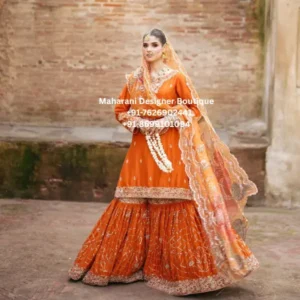 Royal Orange Heritage Embroidered Sharara Suit Discover the beauty of traditional Indian occasion wear with the Royal Orange Heritage Embroidered Sharara Suit, a statement ensemble designed for women who love vibrant colours, intricate embroidery, and graceful silhouettes. The outfit features a rich orange kurta paired with a beautifully flared sharara and a coordinating embroidered dupatta. Moreover, the warm orange colour gives the ensemble a festive and celebratory character, while the detailed embroidery adds an elegant traditional touch. The combination of a structured upper silhouette and dramatically flared sharara creates a beautiful balance. Furthermore, the decorative borders throughout the outfit provide an eye-catching finish, making this ensemble particularly suitable for wedding celebrations and festive events. Whether you are attending a Mehndi in London, a wedding in Toronto, or a family celebration in New York, this orange sharara suit can create a sophisticated and memorable ethnic look. Vibrant Orange Colour The beautiful orange shade is one of the most noticeable features of this outfit. Orange is especially popular for festive and wedding occasions because it creates a warm, energetic, and celebratory appearance. In addition, the colour works beautifully with gold embroidery and traditional jewellery. You can style this outfit with: Gold jewellery Kundan earrings Pearl accessories Traditional bangles Embellished footwear Gold or neutral clutch Therefore, the same outfit can be styled in several different ways depending on the event. Intricate Embroidered Kurta The kurta features delicate embroidery across the neckline, sleeves, and lower border. Moreover, the decorative details create a refined appearance without taking away from the rich orange base. The embroidered border around the hem provides a beautiful transition between the kurta and the dramatically flared sharara. Kurta Highlights Rich orange colour Detailed neckline Embroidered sleeves Decorative hem border Traditional-inspired motifs Elegant ethnic silhouette Occasion-ready styling Furthermore, the long kurta creates a graceful appearance when paired with the wide sharara pants. Statement Sharara Pants The dramatically flared sharara is a defining element of this ensemble. Additionally, the wide-leg silhouette creates beautiful movement while walking and dancing. This makes the outfit particularly suitable for wedding celebrations, Mehndi functions, and Sangeet events. The sharara features decorative embroidery and a detailed lower border. As a result, the bottom portion creates a striking statement while maintaining the traditional charm of the overall ensemble. The flowing silhouette can also look beautiful in photographs, especially during movement. MDB – 9802 , MDB 2206, MDB 0272102, Royal Blue , MDB 21970 Beautiful Embroidered Dupatta The coordinating dupatta completes the outfit. Moreover, the dupatta features a decorative embroidered border and delicate detailing that complements the orange kurta and sharara. It can be styled in several ways: Draped over one shoulder Draped across both shoulders Front pleated drape Traditional head drape Loose side drape Consequently, you can create a traditional or contemporary appearance using the same outfit. Perfect Wedding Outfit The Royal Orange Heritage Embroidered Sharara Suit is an excellent option for wedding celebrations. Wear it for: Wedding ceremonies Mehndi Sangeet Engagement parties Wedding receptions Family wedding functions Bridal showers Destination weddings Pre-wedding celebrations Furthermore, the bright orange colour makes this outfit especially suitable for daytime wedding events and colourful festive celebrations. Mehndi & Sangeet Wear The flowing sharara makes this outfit particularly suitable for Mehndi and Sangeet celebrations. Moreover, the wide flare allows beautiful movement during dancing and photographs. For a Sangeet look, pair it with: Statement earrings Gold bangles Embellished heels Soft curls Glamorous makeup Meanwhile, for a Mehndi celebration, you can choose colourful jewellery and traditional juttis for a more vibrant appearance. Festive Wear This orange ethnic suit can also be styled for a variety of festive occasions. It is suitable for: Diwali Eid Vaisakhi Karwa Chauth Lohri Navratri Raksha Bandhan Family celebrations Cultural events Festive dinners In addition, its classic silhouette means it can remain a versatile piece in your ethnic wardrobe. Engagement Outfit If you want an elegant outfit for an engagement celebration, this embroidered sharara suit provides a beautiful balance between traditional and glamorous styling. Furthermore, the orange colour can be paired with gold or kundan jewellery to create a sophisticated appearance. For a more modern look, choose statement earrings instead of a heavy necklace. Styling Guide Jewellery Gold jewellery complements the orange colour beautifully. Recommended options include: Kundan necklace Gold choker Polki earrings Jhumkas Chandbali earrings Gold bangles Maang tikka Statement rings Moreover, traditional jewellery enhances the heritage character of the outfit. Footwear Complete your look with: Gold heels Embellished sandals Traditional juttis Metallic heels Wedges Embroidered flats Therefore, you can select footwear based on the formality of the occasion. Hair Styling For a traditional wedding look, try a sleek low bun with flowers or traditional hair accessories. Alternatively, soft curls or waves can create a more contemporary appearance. In addition, a side-swept hairstyle can beautifully showcase statement earrings. Makeup The warm orange shade works especially well with glowing makeup. Consider: Warm-toned eyeshadow Defined eyeliner Soft blush Golden highlighter Nude lipstick Peach lipstick Warm rose lipstick As a result, your makeup can complement the outfit while keeping the overall appearance elegant. Wedding Guest Styling This sharara suit is also suitable for wedding guests. For a sophisticated guest look, keep your jewellery slightly lighter and choose a simple hairstyle. Meanwhile, for an evening reception, add statement earrings, a metallic clutch, and embellished heels. Indian Ethnic Wear UK For women searching for Indian ethnic wear in the UK, this orange embroidered sharara suit is an elegant option for weddings and festive celebrations. It can be worn for events in: London Birmingham Leicester Manchester Southall Coventry Moreover, the traditional styling works beautifully for Indian and multicultural wedding celebrations. Indian Ethnic Wear USA Customers in the USA can wear this outfit for Indian weddings, Diwali celebrations, engagement parties, Sangeet events, and family functions. It is suitable for: New York New Jersey California Texas Chicago Washington Furthermore, the vibrant colour and detailed embroidery photograph beautifully at special events. Indian Ethnic Wear Canada For customers looking for Punjabi and Indian ethnic outfits in Canada, this sharara suit offers an elegant occasion-wear option. It can be styled for: Toronto weddings Brampton celebrations Mississauga functions Vancouver events Calgary weddings Edmonton celebrations Therefore, this versatile outfit can work beautifully for both traditional and contemporary celebrations. Why Choose This Orange Sharara Suit? Vibrant Colour Firstly, the rich orange shade creates an attractive festive appearance. Detailed Embroidery Secondly, the embroidery adds traditional elegance and visual depth. Flared Sharara Thirdly, the wide sharara creates beautiful movement. Coordinated Dupatta Furthermore, the embroidered dupatta completes the ensemble beautifully. Versatile Styling Finally, the outfit can be worn for weddings, Mehndi, Sangeet, festivals, engagements, and parties. Product Features Product Type: Sharara Suit Colour: Orange Style: Embroidered Ethnic Wear Set: Kurta, Sharara & Dupatta Silhouette: Flared Sharara Occasion: Wedding, Mehndi, Sangeet, Festive & Party Wear Detailing: Traditional-Inspired Embroidery Category: Indian Ethnic Wear Ideal Markets: UK, USA, Canada & India Care Instructions To maintain the embroidery and colour: Dry clean only. Store in a breathable garment bag. Avoid harsh detergents and bleach. Keep embroidery away from rough surfaces. Avoid prolonged direct sunlight. Use gentle steaming when required. Store the dupatta carefully to protect its embroidered border. Avoid placing heavy items on the sharara. As a result, proper care can help preserve the beauty and appearance of the outfit for future occasions. Orange Sharara Suit, Orange Embroidered Sharara Suit, Designer Sharara Suit, Wedding Sharara Suit, Sharara Suit with Dupatta, Orange Wedding Outfit, Embroidered Sharara Set, Festive Sharara Suit, Mehndi Sharara Suit, Sangeet Sharara Suit, Indian Ethnic Wear UK, Indian Ethnic Wear USA, Indian Ethnic Wear Canada, Sharara Suit UK, Sharara Suit USA, Sharara Suit Canada, Designer Indian Outfit, Wedding Guest Sharara, Luxury Sharara Suit, Maharani Designer Boutique. orange embroidered sharara suit for women, orange sharara suit for wedding, designer orange sharara suit UK, orange wedding outfit USA, embroidered sharara suit Canada, orange Mehndi outfit for women, orange Sangeet sharara suit, Indian wedding sharara UK, designer sharara suit USA, Indian ethnic wear Canada, embroidered sharara with dupatta, orange festive outfit for women, traditional sharara suit for wedding, luxury sharara suit for women, orange wedding guest outfit, designer ethnic wear for women UK, Indian wedding outfit USA, Indian wedding outfit Canada, embroidered orange suit for Mehndi, Maharani Designer Boutique sharara suit.