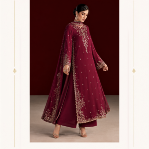 Burgundy Embroidered Salwar Suit with Dupatta Step into timeless elegance with the Maharani Burgundy Royale Embroidered Salwar Suit, a sophisticated designer ensemble crafted for women who love rich colours, graceful silhouettes, and intricate Indian craftsmanship. The deep burgundy shade gives this salwar suit a luxurious and regal appeal, while the delicate golden embroidery adds an elegant festive touch. The beautifully designed long kurta features a graceful neckline highlighted with intricate floral embroidery that extends down the front. Fine scattered embellishments across the kurta create subtle sparkle, while the richly embroidered sleeves add definition and sophistication to the overall look. Burgundy Embroidered Salwar Suit The flowing silhouette offers a graceful fall and an effortlessly elegant appearance. The matching burgundy bottom complements the kurta perfectly, creating a coordinated and polished outfit. Its clean design allows the detailed embroidery on the kurta and dupatta to remain the highlight of the ensemble. The sheer matching dupatta is finished with an ornate embroidered border featuring delicate floral and traditional motifs. The detailed border beautifully frames the dupatta and adds movement and richness when draped over the shoulder. Designed by Maharani Designer Boutique, this elegant salwar suit is perfect for women looking for a sophisticated outfit for weddings, receptions, festive celebrations, parties, and special family occasions. Key Features Rich burgundy / deep wine colour Designer salwar suit silhouette Intricate golden floral embroidery Embellished neckline and front detailing Heavily embroidered sleeve borders Matching burgundy bottom Sheer embroidered dupatta Ornate floral dupatta border Elegant and sophisticated Indian styling Perfect for festive and special occasions Perfect For This designer burgundy salwar suit is an excellent choice for: Wedding guest wear Wedding receptions Engagement ceremonies Sangeet functions Diwali and festive celebrations Family gatherings Evening parties Formal celebrations Dinner events Traditional occasions Maharani Designer Boutique Jalandhar Pair this rich burgundy salwar suit with golden jhumkas, a delicate choker, bangles, and an embellished clutch for a classic festive appearance. Metallic or nude heels can complete the look beautifully. For a more traditional styling, add kundan or polki-inspired jewellery and wear your hair in a sleek bun or soft updo. For a contemporary appearance, choose statement earrings, minimal accessories, soft waves, and a compact clutch. Maharani Burgundy Royal , Deep Burgundy Anarkali Suit , Bridal Lehenga Choli with Heavy Gold Embroidery, MDB 025278, MDB 025331 The deep burgundy colour pairs especially well with gold accessories, making this ensemble an ideal choice for evening celebrations and luxurious wedding events. Product Details Brand: Maharani Designer Boutique Product Type: Designer Salwar Suit Colour: Burgundy / Deep Wine Work: Intricate Embroidery & Embellishment Style: Elegant Indian Occasion Wear Occasion: Wedding, Party, Reception & Festive Wear Set: Embroidered Kurta, Bottom & Dupatta