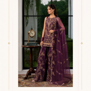 Designer Plum Purple Embroidered Salwar Suit by Maharani Designer Boutique Step into timeless elegance with the Noor-e-Shaam Plum Embroidered Salwar Suit, a sophisticated designer ensemble created for women who appreciate luxurious colours, intricate detailing and graceful Indian ethnic fashion. Designed under the signature aesthetic of Maharani Designer Boutique, this beautiful purple salwar suit combines a richly embroidered kurta, flowing wide-leg salwar and an elegant sheer dupatta to create a complete occasion-ready look. The deep plum-purple colour gives this outfit an effortlessly regal character. The darker base provides the perfect canvas for the intricate gold-toned embroidery, allowing every floral and ornamental detail to stand out beautifully. From the embellished neckline and front panel to the ornate kurta hem, embroidered sleeves and wide-leg salwar, every element contributes to the luxurious appearance of the ensemble. The accompanying dupatta adds softness and movement to the outfit. Its lightweight, sheer appearance complements the richness of the embroidered kurta and salwar, while the decorated edging provides a polished finishing touch. Whether you are looking for a designer salwar suit for wedding celebrations, an elegant Punjabi salwar suit for women, a sophisticated outfit for a family function or a statement party wear salwar suit, the Noor-e-Shaam design offers a versatile choice for your ethnic wardrobe. Rich Plum Purple Colour The beautiful plum-purple shade is the first detail that captures attention. Deep purple tones have an inherently luxurious appearance and work particularly well with gold embroidery. This design uses the rich colour as a foundation for the complete ensemble, creating a dramatic yet sophisticated aesthetic. The colour is suitable for evening celebrations, wedding functions and festive occasions where deeper shades can make a strong style statement. Unlike extremely bright colours, plum allows the embroidery to become the visual focus. The gold detailing appears warmer and more prominent against the dark purple background. The result is a graceful combination that feels traditional, elegant and contemporary at the same time. Intricate Embroidered Kurta The kurta is the central element of this designer salwar suit. It features an elegant straight-to-relaxed silhouette with detailed embroidery covering the front. The embroidery follows floral and ornamental patterns, creating an intricate surface that catches the light beautifully. The upper neckline is decorated with concentrated embroidery, giving the face-framing area a luxurious appearance. From the neckline, embroidery flows downward through the front of the kurta, creating a natural vertical emphasis. The lower portion features an ornate embroidered border that provides definition to the hemline. This combination of detailed upper embroidery and decorative borders creates a balanced design without making the outfit appear visually heavy. Beautiful Embroidered Neckline The neckline is one of the most eye-catching features of the kurta. The rounded neckline is framed with detailed gold-toned embroidery, while additional ornamental work extends down the front. Royal Plum Embroidered Designer Saree,MDB 024248,MDB – 9802 ,MDB – 9801 ,MDB 11510 The design creates a flattering focal point around the upper body. It can be paired beautifully with a traditional choker, statement necklace or even oversized earrings if you prefer to keep the neckline jewellery-free. The embroidery itself provides enough visual detail to create a luxurious appearance even when styled with minimal accessories. Detailed Front Embroidery The front of the kurta features an elaborate arrangement of floral-inspired embroidery. Fine gold-toned motifs are distributed across the purple base, creating depth and texture. The embroidery is particularly concentrated around the neckline, centre front and lower border. This creates a beautiful transition from detailed upper work to the decorative hem. The floral patterns add femininity while the deep colour keeps the overall look sophisticated. Elegant Full Sleeves The full sleeves provide a refined and graceful appearance. They are embellished with detailed embroidery, particularly toward the lower sleeve area. The embroidered cuffs create a decorative finish around the wrists and coordinate with the kurta hem. This makes the outfit especially attractive when paired with bangles or a statement bracelet. For a traditional appearance, style the sleeves with gold bangles. For a more contemporary look, choose a single statement bracelet or keep the wrists simple. Wide-Leg Salwar The wide-leg salwar gives this outfit a distinctive contemporary ethnic silhouette. The flowing lower silhouette provides beautiful movement and creates a relaxed, elegant appearance. The salwar is decorated with elaborate floral and ornamental embroidery that coordinates with the kurta. Its broad shape creates a graceful fall around the legs while maintaining the traditional character associated with Indian salwar suits. The wide-leg design also makes the outfit suitable for women who prefer an alternative to narrow trousers or churidar-style bottoms. Embroidered Salwar Detailing The salwar features detailed embroidery extending vertically and across the lower portion. Floral vines and ornamental motifs create visual continuity with the kurta. The embroidery becomes more concentrated toward the bottom, giving the salwar a beautifully finished appearance. The detailed lower border adds definition and makes the wide-leg silhouette appear even more elaborate. When paired with the long kurta, the embroidered salwar creates a coordinated head-to-toe appearance. Sheer Embroidered Dupatta The dupatta completes the Noor-e-Shaam ensemble. Its sheer appearance creates a delicate contrast against the richly embroidered outfit. The purple tone maintains continuity with the kurta and salwar, while scattered floral motifs add subtle decoration throughout. The edges are finished with an embroidered border that frames the dupatta beautifully. The border becomes particularly noticeable when the dupatta is draped over one shoulder and allowed to fall vertically. Multiple Dupatta Styling Options One of the advantages of this salwar suit is the versatility of its dupatta. One-Shoulder Drape For a contemporary appearance, place the dupatta over one shoulder and let it fall naturally along the side. Two-Shoulder Drape For a traditional Indian appearance, place the dupatta over both shoulders. Front Drape For a more formal presentation, drape the dupatta across the front and allow the embroidered borders to frame the outfit. Head Drape For wedding ceremonies or traditional family occasions, the dupatta can be styled over the head. Designer Salwar Suit for Weddings The Noor-e-Shaam Plum Purple Salwar Suit is an elegant option for wedding-related celebrations. It can be styled for: Wedding ceremonies Wedding receptions Engagement parties Sangeet functions Mehndi celebrations Family weddings Festive dinners Traditional gatherings Formal ethnic events The rich purple shade creates a sophisticated wedding guest appearance without relying on an overly bright colour palette. Pair it with gold jewellery and embellished footwear for a classic festive look. Punjabi Salwar Suit Styling For women who love Punjabi ethnic fashion, this ensemble can be styled with traditional accessories. Consider pairing it with: Gold jhumkas: A timeless choice for Punjabi-inspired styling. Bangles: Stack gold or purple-toned bangles around the wrists. Punjabi juttis: Choose embroidered or metallic juttis for a traditional finish. Paranda-inspired hairstyle: A braid can create a distinctly traditional appearance. Statement ring: A large ring can complete the festive styling. This combination works especially well for family celebrations, wedding functions and cultural occasions. Party Wear Salwar Suit The Noor-e-Shaam design can also be styled as a sophisticated party wear salwar suit. For an evening party, simplify the jewellery and allow the embroidery to take centre stage. Wear: Statement earrings Metallic heels A structured clutch Soft waves Refined makeup This creates a modern ethnic party look without compromising the traditional character of the ensemble. Festive Wear for Women Deep purple and gold make a beautiful combination for festive occasions. This salwar suit can be worn for celebrations such as Diwali, family festivals, cultural gatherings and festive dinners. For daytime events, pair it with lighter jewellery and understated makeup. For evening occasions, choose statement earrings, glowing makeup and metallic footwear. The versatility of the colour makes the outfit easy to adapt to different celebrations. Engagement Party Outfit If you are attending an engagement celebration, this designer salwar suit offers a sophisticated alternative to a lehenga. The wide-leg salwar creates volume and movement, while the embroidered kurta provides a polished silhouette. Style it with: Gold chandelier earrings A delicate choker Embellished clutch Metallic heels Soft curls The result is elegant without appearing excessively bridal. Family Function Wear For family celebrations, the outfit can be styled in a more traditional manner. Choose a classic dupatta drape, gold earrings and comfortable ethnic footwear. A simple bun or braid can complete the appearance. Because the embroidery already provides visual richness, additional accessories can be kept relatively simple. Jewellery Pairing The plum-purple and gold combination offers numerous jewellery possibilities. Gold Jewellery Gold is the natural choice for this colour palette. A gold choker can emphasize the embroidered neckline. Kundan Jewellery Kundan-style jewellery can create a more traditional wedding appearance. Polki-Inspired Jewellery For an elevated festive appearance, choose polki-inspired earrings or a necklace. Jhumkas Large gold jhumkas provide a classic Indian look. Chandbalis Chandbali earrings can add a statement element without requiring a necklace. Bangles Gold bangles, purple bangles or a combination of both can coordinate beautifully. Footwear Styling The wide-leg salwar works well with both traditional and contemporary footwear. Recommended options include: Gold heels Metallic sandals Embroidered Punjabi juttis Traditional mojaris Nude block heels Champagne-toned heels Embellished flats For long wedding functions, block heels or embellished flats may provide greater comfort. Clutch and Bag Suggestions Choose accessories that complement rather than compete with the embroidery. A gold clutch is a classic option. A champagne or neutral embellished clutch can create a softer appearance. For a traditional Punjabi look, choose an embroidered potli bag. A purple clutch can also create a monochromatic appearance. Hairstyle Inspiration The hairstyle can significantly change the character of this outfit. Soft Waves Loose waves create a contemporary feminine look. Sleek Bun A sleek bun creates a sophisticated formal appearance. Low Chignon A low chignon works beautifully with statement earrings. Traditional Braid A braid adds a classic Indian touch. Half-Up Hairstyle A half-up hairstyle offers a balance between traditional and modern styling. Makeup Suggestions The rich purple colour works beautifully with warm neutral makeup. For daytime functions, consider: Soft brown eyeshadow Defined eyebrows Subtle eyeliner Peach or rose blush Nude or mauve lipstick For evening celebrations: Gold or bronze eyeshadow Defined eyeliner Soft highlighter Warm blush Berry, plum or deeper nude lip colour Keep the overall makeup balanced so the embroidered outfit remains the centre of attention. Contemporary Ethnic Styling Although rooted in traditional Indian fashion, this salwar suit can easily be styled in a contemporary way. Choose oversized earrings instead of a heavy necklace. Wear the dupatta casually over one shoulder. Pair the outfit with sleek heels. Style the hair in loose waves. Carry a structured clutch. This approach creates a modern designer ethnic appearance while retaining the traditional beauty of the salwar suit. Traditional Styling For a more classic appearance, use the complete traditional styling approach. Drape the dupatta across both shoulders. Add a gold choker, jhumkas, bangles and a statement ring. Choose Punjabi juttis or embellished mojaris. Style the hair into a bun or braid. This look is particularly suitable for weddings and cultural celebrations. A Versatile Addition to Your Ethnic Wardrobe A beautifully designed salwar suit can be worn repeatedly by changing the accessories and styling. The Noor-e-Shaam ensemble can transition from an elegant family function outfit to a sophisticated wedding guest look simply by changing the jewellery and footwear. For a daytime celebration, choose delicate accessories. For an evening event, introduce statement jewellery and metallic heels. For a traditional function, add bangles, jhumkas and a classic dupatta drape. This versatility makes the ensemble suitable for multiple occasions. Why Choose the Noor-e-Shaam Salwar Suit? Deep Plum Purple Base A rich and sophisticated colour suitable for festive and evening occasions. Gold-Toned Embroidery Creates an elegant contrast and luxurious visual appeal. Embroidered Kurta Detailed neckline, front motifs, sleeves and lower border provide a coordinated appearance. Wide-Leg Salwar Offers graceful movement and a contemporary ethnic silhouette. Matching Dupatta Adds softness and completes the ensemble. Multiple Styling Possibilities Can be styled traditionally or with a modern fashion approach. Occasion Versatility Suitable for weddings, receptions, engagements, parties, festive events and family celebrations. Designed for the Modern Indian Woman The Noor-e-Shaam Salwar Suit brings together the heritage of Indian ethnic dressing with a contemporary silhouette. The traditional embroidery provides cultural richness, while the wide-leg salwar introduces a modern element. The deep purple colour gives the ensemble an elegant personality that works particularly well for women who prefer sophisticated shades over conventional bright colours. The flowing dupatta adds movement and softness, making the outfit feel graceful from every angle. Maharani Designer Boutique Maharani Designer Boutique brings an elegant approach to Indian occasion wear, focusing on beautiful silhouettes, sophisticated colours and detailed ethnic styling. The Noor-e-Shaam Plum Purple Salwar Suit reflects this design philosophy through its rich colour combination, intricate embroidery and coordinated three-piece appearance. The ensemble is designed for women who want their ethnic clothing to feel special, polished and occasion appropriate. Whether you are shopping for a Punjabi salwar suit, designer salwar suit, wedding wear suit or party wear salwar suit, this design offers a refined option for your wardrobe. Product Details Product Name: Noor-e-Shaam Plum Embroidered Salwar Suit Brand: Maharani Designer Boutique Category: Designer Salwar Suit Colour: Deep Plum Purple Top: Embroidered long kurta Bottom: Wide-leg embroidered salwar Dupatta: Coordinated sheer embroidered dupatta Embroidery: Gold-toned floral and ornamental detailing Neckline: Embroidered round neckline with central detailing Sleeves: Full sleeves with embellished cuffs Style: Designer Indian Ethnic Wear Occasions: Weddings, Receptions, Engagements, Sangeet, Mehndi, Parties and Festive Events Product note: Exact fabric composition, lining, embroidery technique, measurements, embellishment materials and customization details should be confirmed with Maharani Designer Boutique before ordering, as these specifications cannot be determined with certainty from the photograph alone. Care Instructions Because this ensemble features detailed embroidery and a delicate-looking dupatta, careful handling is recommended. Keep the outfit stored in a clean, breathable garment bag when not in use. Avoid direct exposure to strong sunlight for extended periods. Do not spray perfume directly onto the fabric or embroidered sections. Take care when wearing jewellery, watches or accessories that could catch on embroidery. After wearing the outfit, allow it to air before storing it. Follow the garment-specific cleaning instructions supplied with the finished product. Professional cleaning may be preferable depending on the actual fabric and embellishment used. Fold the dupatta carefully to protect its embroidered border. Avoid placing heavy garments or objects directly over the embroidered areas during storage. Final Product Description The Noor-e-Shaam Plum Embroidered Salwar Suit by Maharani Designer Boutique is an elegant expression of contemporary Indian ethnic fashion. Its deep plum-purple colour creates a rich and sophisticated foundation, while the gold-toned embroidery brings traditional luxury to the overall design. The beautifully decorated neckline frames the upper portion of the kurta, while detailed embroidery continues across the front, sleeves and lower border. The wide-leg salwar introduces graceful volume and movement, with floral and ornamental embroidery adding richness throughout the lower silhouette. The coordinating sheer dupatta completes the outfit with delicate motifs and an ornate border, offering several styling possibilities for different occasions. Wear it traditionally with a gold choker, jhumkas, bangles and Punjabi juttis, or create a modern evening appearance with statement earrings, metallic heels, soft waves and a structured clutch. From wedding celebrations and receptions to engagement parties, sangeet functions, festive gatherings and formal family events, this designer salwar suit offers an elegant and versatile choice. The rich purple colour makes it particularly striking for evening occasions, while the timeless embroidery ensures that the ensemble remains rooted in classic Indian fashion. Noor-e-Shaam is made for moments when elegance matters—from intimate family celebrations to grand wedding festivities. Discover sophisticated ethnic fashion with Maharani Designer Boutique and make your next celebration memorable in a beautifully embroidered designer salwar suit. salwar suit, salwar suit for women, designer salwar suit, purple salwar suit, plum purple salwar suit, embroidered salwar suit, Punjabi salwar suit, Punjabi salwar suit for women, Punjabi suit, designer Punjabi suit, Punjabi suit for wedding, Punjabi wedding suit, Punjabi party wear suit, party wear salwar suit, wedding wear salwar suit, salwar suit for wedding, salwar suit for reception, salwar suit for engagement, salwar suit for sangeet, salwar suit for mehndi, festive salwar suit, Indian ethnic wear for women, designer ethnic wear, embroidered Punjabi suit, purple Punjabi suit, purple Punjabi suit for wedding, ladies salwar suit, Maharani Designer Boutique, Maharani Designer, Punjabi suit boutique, designer suit boutique.