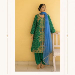 Emerald Royal Zari Embroidered Green Salwar Suit Step into timeless Indian elegance with our Emerald Royal Zari Embroidered Green Suit Set, a beautifully detailed ensemble created for women who appreciate traditional craftsmanship with a sophisticated contemporary appeal. The rich emerald green color gives this outfit a regal and luxurious appearance, while the intricate gold-toned embroidery creates a striking contrast across the front and sleeves. The overall design combines classic Indian motifs, delicate floral patterns, paisley-inspired elements, and ornamental detailing to create an ensemble that feels both traditional and glamorous. The highlight of this suit is its beautifully embroidered long straight-cut kurta. The front is enhanced with elaborate symmetrical embroidery running vertically along the neckline and center panel. Intricate floral and paisley-inspired motifs extend through the body of the kurta, creating a graceful elongated appearance. The sleeves feature an elegant gold lattice or jaali-inspired pattern, complemented by ornate embroidery near the cuffs. This detailing adds depth to the outfit while maintaining the sophisticated character of the overall design. Adding a beautiful pop of contrast is the blue dupatta. Draped elegantly over the outfit, the lightweight-looking blue fabric creates a refreshing contrast against the deep green kurta. Fine gold detailing and a decorative border complete the dupatta, giving the ensemble an especially festive appearance. The matching green bottom coordinates beautifully with the kurta and creates a balanced head-to-toe look. The understated bottom allows the heavily embellished kurta and contrasting dupatta to remain the focal points of the outfit. This designer suit set is an excellent choice for weddings, festive celebrations, engagement functions, traditional ceremonies, family gatherings, Eid celebrations, Diwali festivities, parties, and other special occasions. Rich Emerald Green Color The deep emerald green base gives the outfit a luxurious jewel-toned character. Green is traditionally associated with elegance, prosperity, celebration, and sophistication in Indian fashion. The darker shade also provides an ideal canvas for the gold embroidery to stand out beautifully. Intricate Gold Embroidery The ornate gold embroidery is the defining feature of the design. Floral, paisley, ornamental and traditional-inspired motifs are arranged throughout the front, creating a rich handcrafted appearance. The symmetrical placement gives the kurta a polished designer finish. Elegant Blue Dupatta The contrasting blue dupatta adds visual freshness to the otherwise rich green-and-gold palette. Its delicate gold detailing and decorative edging complement the embroidery of the kurta while giving the complete outfit a graceful finishing touch. Versatile Occasion Wear The Emerald Royal Zari suit can be styled for a variety of celebrations. Pair it with traditional jewellery for a wedding or festive function, or keep the accessories minimal for a sophisticated daytime ethnic look. It can be paired beautifully with: Gold jhumkas Kundan jewellery Polki jewellery Statement earrings Traditional bangles Embellished footwear Gold-toned clutch Potli bag Traditional hair accessories A Statement Ethnic Look The combination of emerald green, antique-style gold embroidery, and contrasting blue creates a distinctive color story. Rather than relying on excessive embellishment, the outfit uses carefully positioned embroidery to create a luxurious visual effect. The long silhouette of the kurta gives the outfit an elegant appearance, while the coordinated green bottom maintains the traditional character of the ensemble. The blue dupatta can be draped over one shoulder, around the neck, or across the front depending on the desired styling. Perfect for Indian Festive Fashion Whether you're attending a wedding celebration, festive dinner, family gathering, religious ceremony, engagement function, or special occasion, this suit set offers a refined ethnic look. The design combines the richness of traditional Indian clothing with a sophisticated color combination that can work across different celebrations. Key Product Highlights Designer emerald green ethnic suit set Rich green kurta with elaborate gold embroidery Intricate floral and paisley-inspired motifs Decorative embroidered center panel Gold lattice-pattern sleeves Embellished sleeve borders Coordinated green bottom Contrasting blue dupatta Gold detailing on dupatta Elegant traditional Indian aesthetic Suitable for festive and wedding occasions Statement ethnic wear for women Sophisticated jewel-tone color combination Ideal for gifting and special occasions  Embroidered Green Salwar Suit You can use these keywords throughout your website, product tags, collection pages, image alt text, and marketing content: emerald green suit set, green designer suit, green embroidered salwar suit, green ethnic wear, designer salwar suit for women, embroidered green suit, green gold suit set, wedding wear suit for women, festive wear suit, Indian ethnic wear, designer ethnic suit, green party wear suit, embroidered salwar kameez, green kurta set, green dupatta suit, gold embroidered suit, traditional Indian suit, wedding guest outfit, festive ethnic wear, designer Punjabi suit, green traditional dress, women ethnic wear, Indian wedding outfit, embroidered kurta set, luxury ethnic wear, designer Indian clothing, green and blue suit set, zari work suit, festive salwar kameez, traditional wear for women.