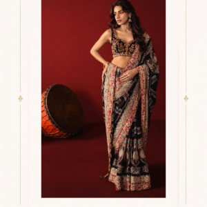 Maharani Black Crimson Heritage Printed Saree Make a striking statement with the Maharani Black Crimson Heritage Saree, Black Designer Saree with Traditional Printed Border & Embroidered Blouse , Maharani Designer Boutique Jalandhar, a contemporary ethnic ensemble that blends bold traditional prints with elegant designer detailing. Perfect for weddings, festive celebrations, cocktail evenings, cultural events, parties and special occasions, this saree brings together traditional Indian artistry and contemporary styling. Brand: Maharani Designer Boutique Category: Designer Saree Colour: Black, Crimson & Beige Work: Printed Detailing & Embroidered Blouse Occasion: Festive, Party & Wedding Wear Maharani Royal Crimson Bridal Lehenga,Maharani Crimson Heritage Embroidered Salwar Suit,Maharani Royal Crimson Bridal Gown,Royal Crimson Heritage Heavy Embroidered Bridal Lehenga,MDB 026345