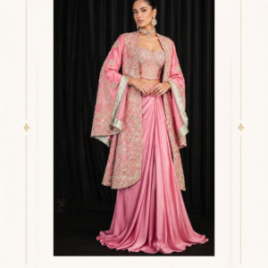 Maharani Blush Pink Royal Embroidered Couture Saree Gown Make a glamorous statement with the Maharani Blush Pink Royal Embroidered Couture Saree Gown, Blush Pink Designer Saree Gown with Heavy Embroidered Jacket, Maharani Designer Boutique Jalandhar, an exquisite fusion of traditional Indian elegance and contemporary designer fashion. This luxurious ensemble is designed for women who love sophisticated silhouettes, intricate craftsmanship, and timeless ethnic wear. Product Details Colour: Blush Pink Category: Designer Saree Gown Design: Draped saree-style skirt with a long jacket Work: Intricate floral embroidery with metallic detailing Blouse: Embellished designer blouse Jacket: Long embroidered jacket with statement sleeves Style: Luxury, contemporary, and traditional fusion Occasion: Wedding receptions, engagements, cocktail parties, and festive events Brand: Maharani Designer Boutique