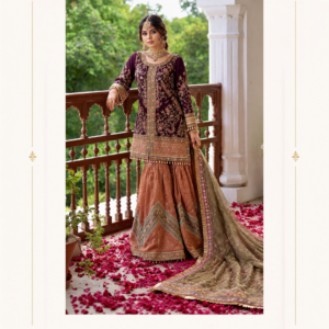 Maharani Maroon & Rose Gold Embroidered Sharara Suit Elevate your festive wardrobe with the Maharani Maroon & Rose Gold Embroidered Sharara Suit, a regal ensemble blending rich traditional embroidery with an elegant contemporary silhouette. The deep maroon kurta is beautifully embellished with intricate floral and vine-inspired embroidery, highlighted with antique-gold and subtle multicolour detailing. This designer sharara suit is perfect for weddings, mehendi, sangeet, festive celebrations, receptions and elegant evening occasions. Brand: Maharani Designer Boutique Category: Designer Sharara Suit Colour: Maroon, Rose Gold & Olive Gold Work: Intricate Embroidery & Embellishment Occasion: Wedding, Mehendi, Sangeet, Reception & Festive Wear