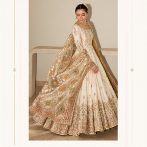 Maharani Serene Ivory Royal Embroidered Anarkali Gown Step into timeless elegance with the Maharani Serene Ivory Royal Embroidered Anarkali Gown, Ivory Anarkali Gown with Multicolour Floral Embroidery & Luxury Dupatta , Maharani Designer Boutique Jalandhar, a luxurious creation from Maharani Designer Boutique. Designed for women who appreciate sophisticated Indian ethnic wear, this stunning ensemble features an elegant ivory base adorned with intricate gold embroidery and delicate multicolour floral accents. Discover premium designer ethnic wear at Maharani Designer Boutique, with worldwide shipping for customers in India and overseas. Product Highlights Colour: Ivory with gold and multicolour accents Style: Floor-length Anarkali gown Work: Intricate gold embroidery with floral detailing Silhouette: Flared, floor-length design Dupatta: Matching embellished dupatta with a statement border Occasions: Weddings, receptions, engagements and festive celebrations