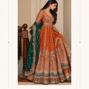 Maharani Rust Royale Emerald Gold Embroidered Anarkali Gown Experience royal elegance with the Maharani Rust Royale Emerald Gold Embroidered Anarkali Gown, Maharani Rust Orange Gold Embroidered Anarkali Gown with Emerald Green Dupatta , Maharani Designer Boutique Jalandhar, a stunning designer outfit created for women who love luxurious Indian ethnic wear. Featuring a rich rust-orange colour, this beautiful Anarkali gown showcases intricate golden embroidery across the fitted bodice, full sleeves, and voluminous flared skirt. The delicate floral patterns, ornate embroidered panels, and richly embellished scalloped hemline create a graceful and sophisticated appearance. Discover premium designer ethnic wear at Maharani Designer Boutique, with shipping available across India and internationally. Product Highlights Colour: Rust orange with emerald green accents Style: Designer Anarkali gown Embroidery: Intricate golden floral embroidery Sleeves: Full sleeves with detailed embellishments Dupatta: Emerald green with an embroidered border Hemline: Ornate scalloped border with layered detailing Occasions: Weddings, receptions, sangeet, and festive celebrations Brand: Maharani Designer Boutique